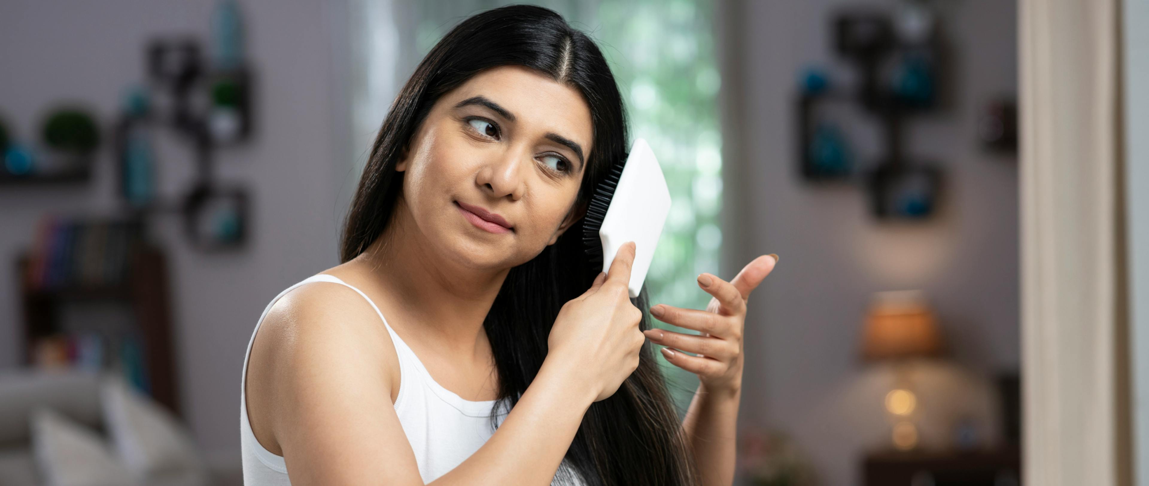 A girl doing hair care