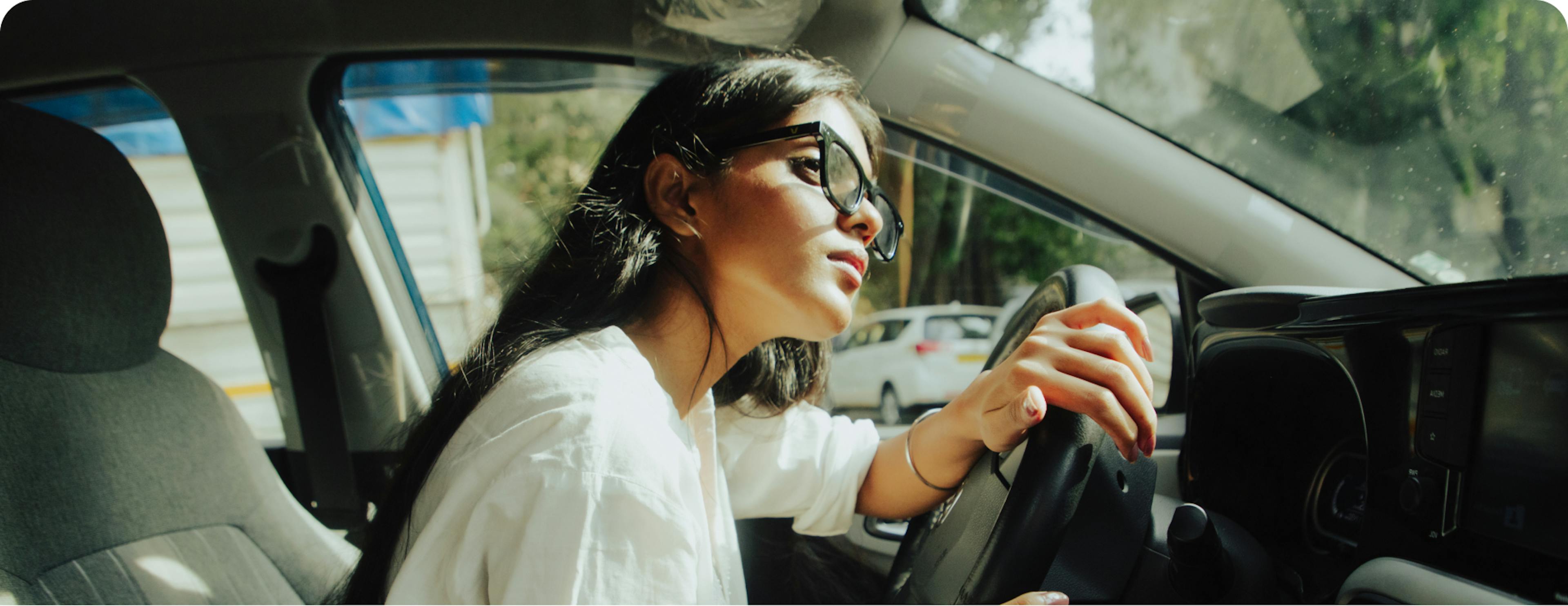 Lady driving Car