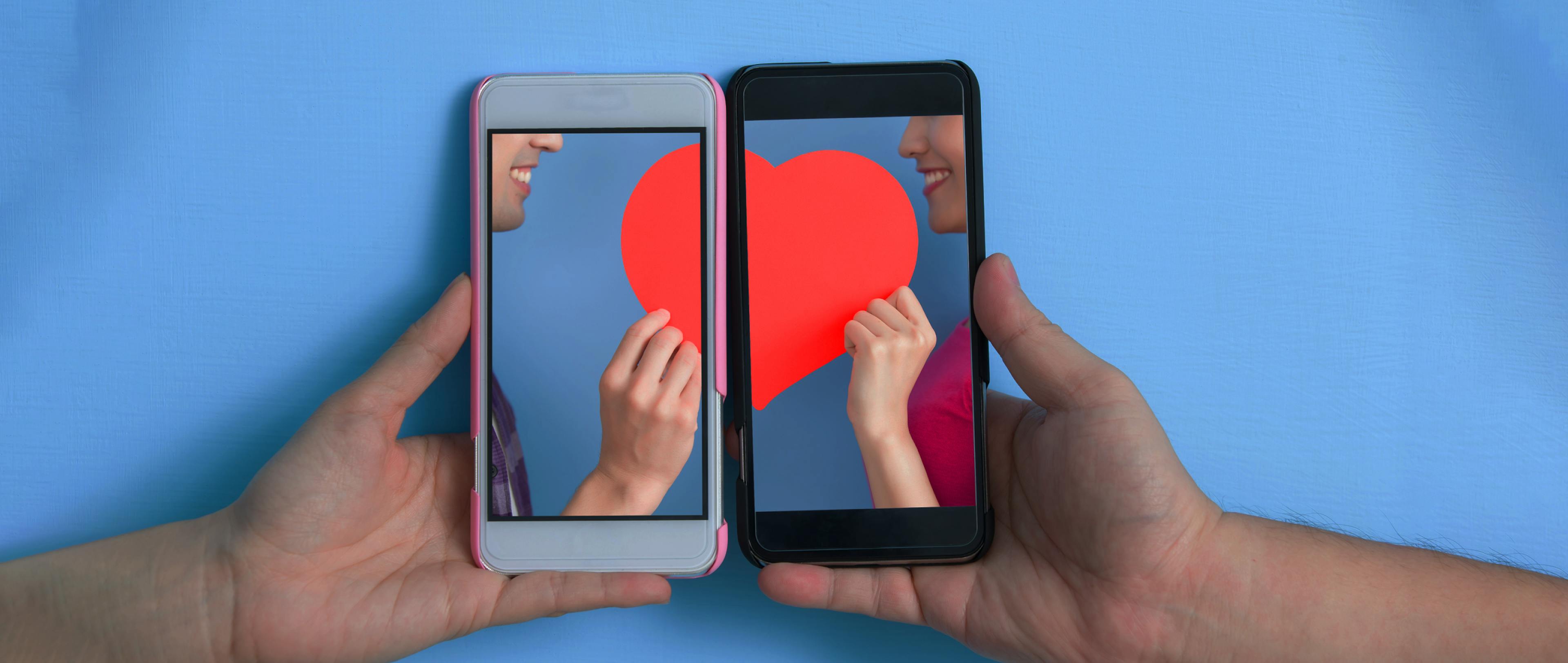 A picture of a heart divided into 2 phone's screen