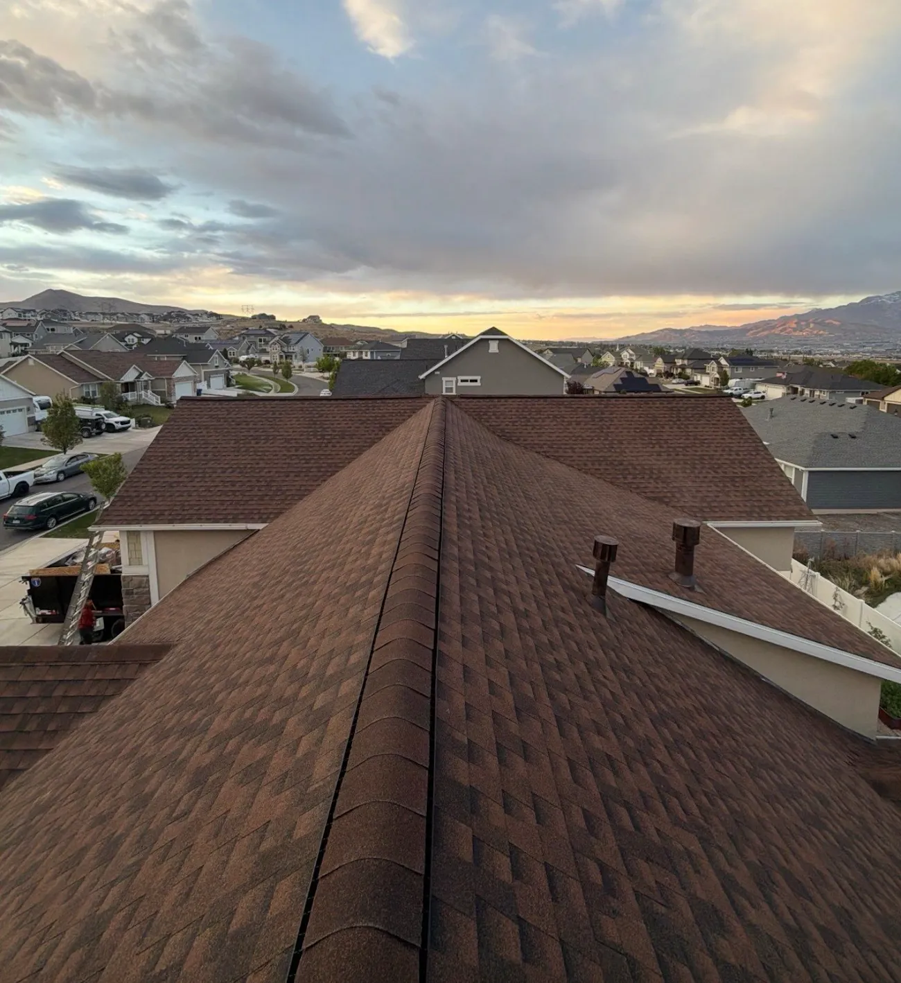 professional residential roof replacement with brown architectural shingles and ridge detail - Provo, UT - Flux Provo Roofing & Siding