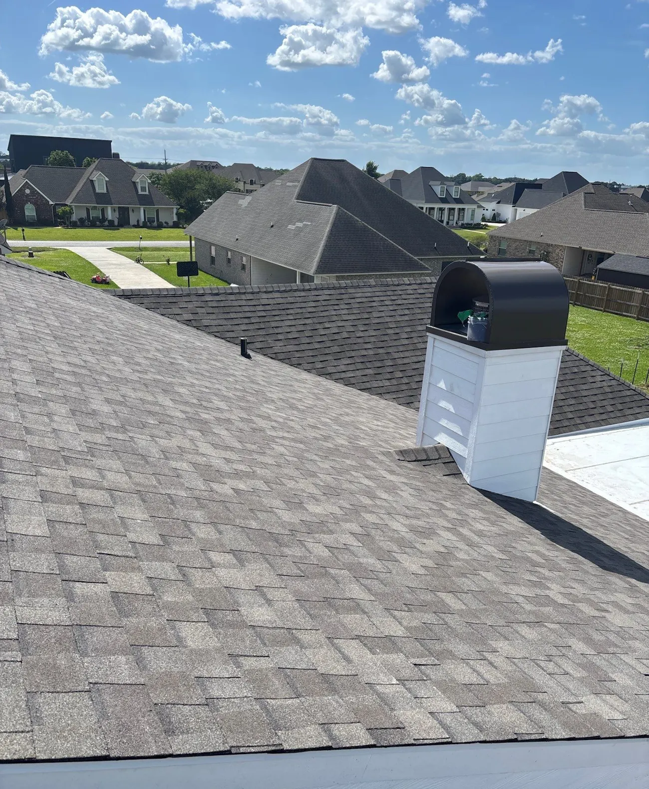 professional residential roof replacement with grey brown architectural shingles and chimney cap - Provo, UT - Flux Provo Roofing & Siding