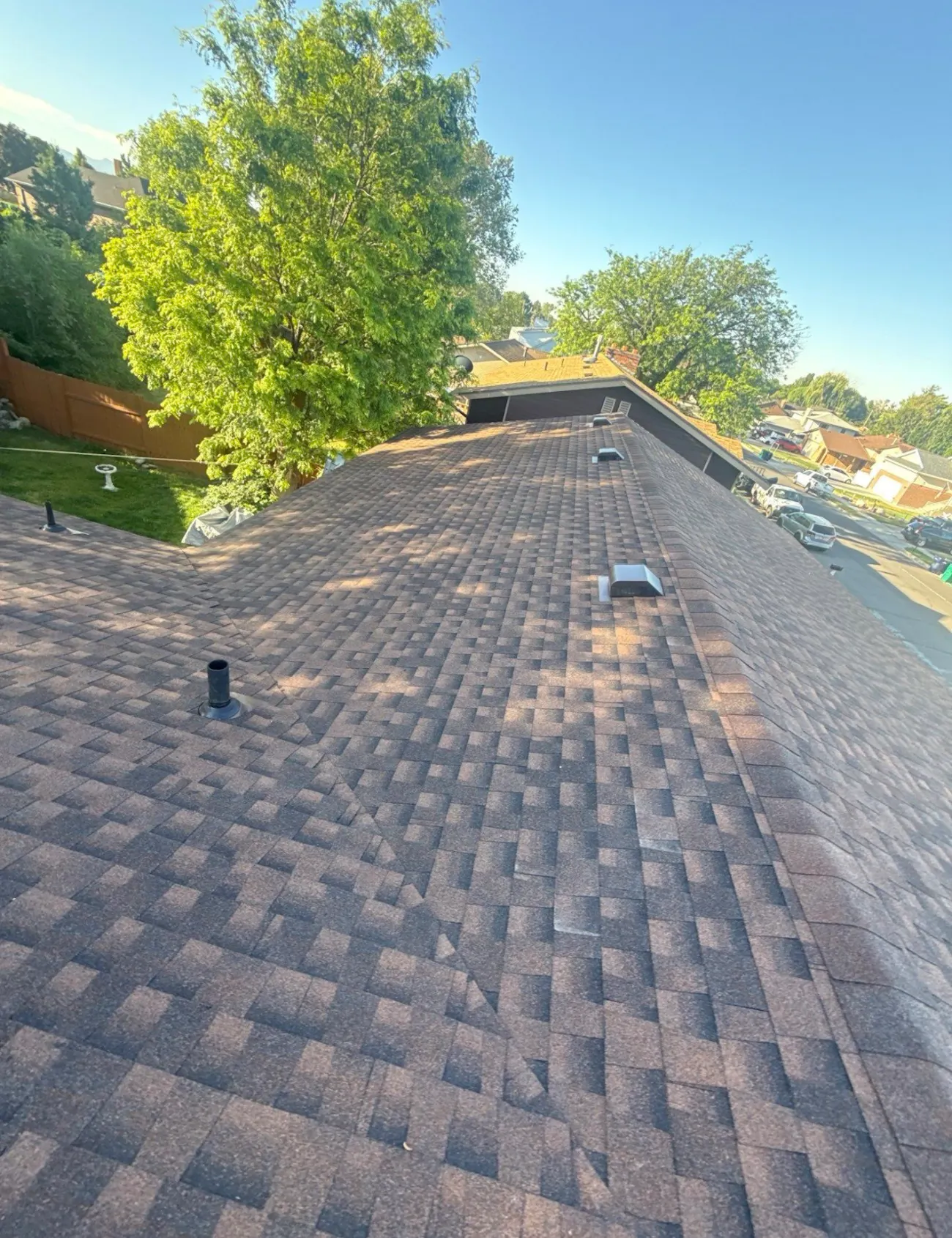 residential roof installation with brown architectural shingles and roof vent system - Boise, ID - Flux Boise Roofing & Siding