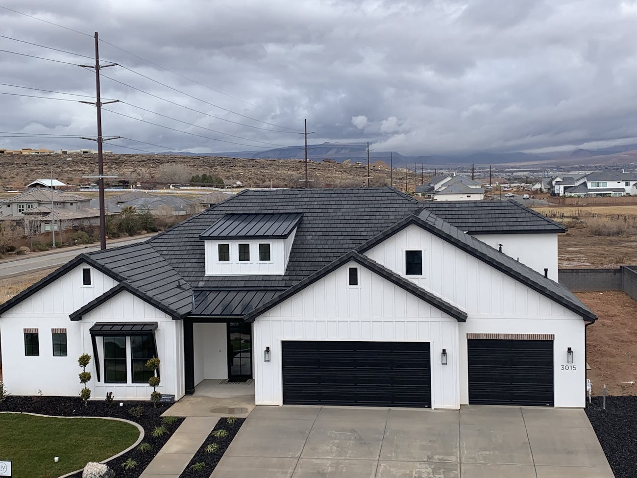 Completed roof with white stucco siding