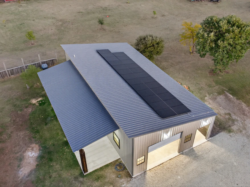 Metal roof on detached garage with solar panels