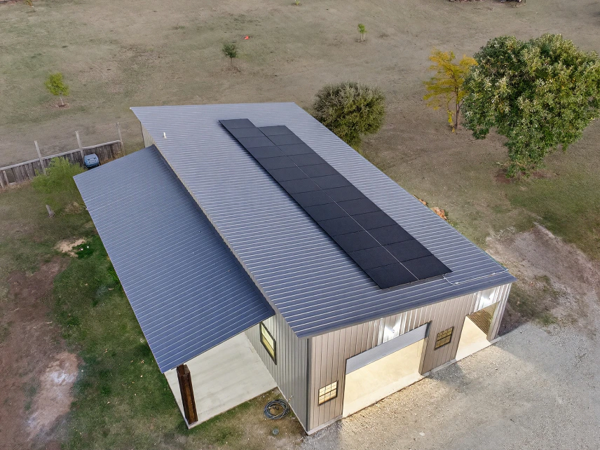 Metal roof on detached garage with solar panels