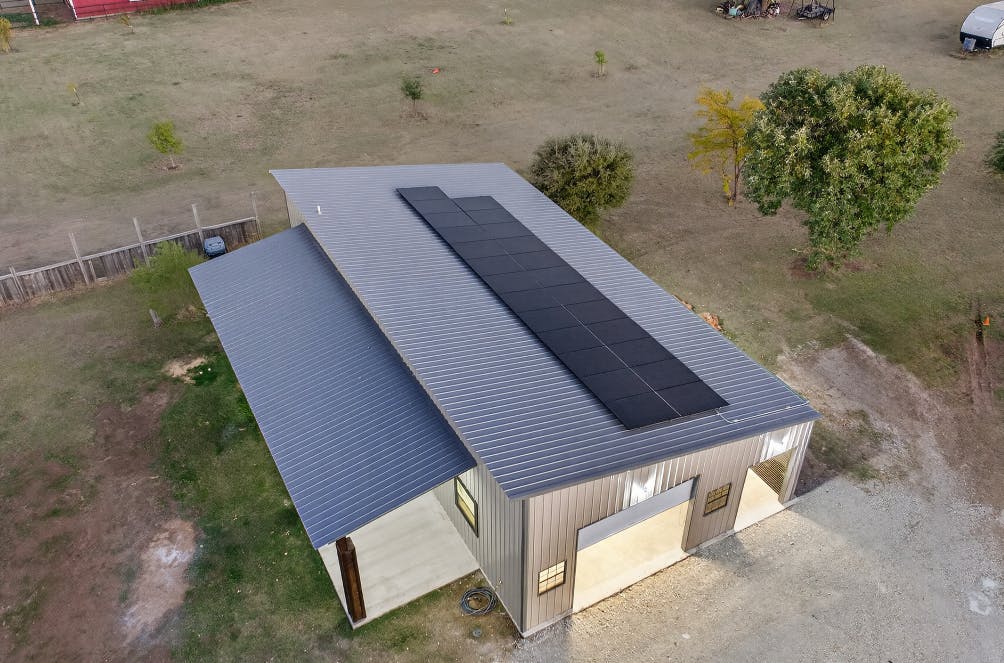 Metal roof on detached garage with solar panels