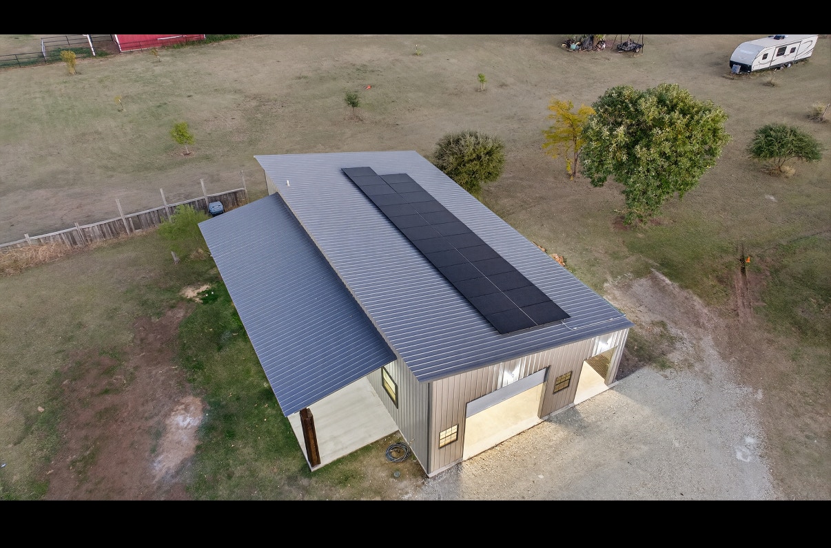 Metal roof on detached garage with solar panels