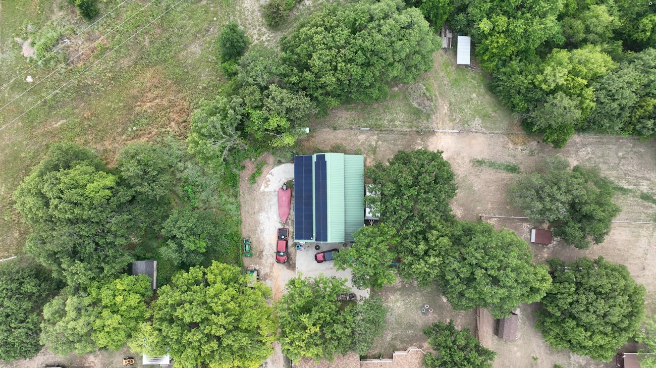 Aerial roof view of barn with solar