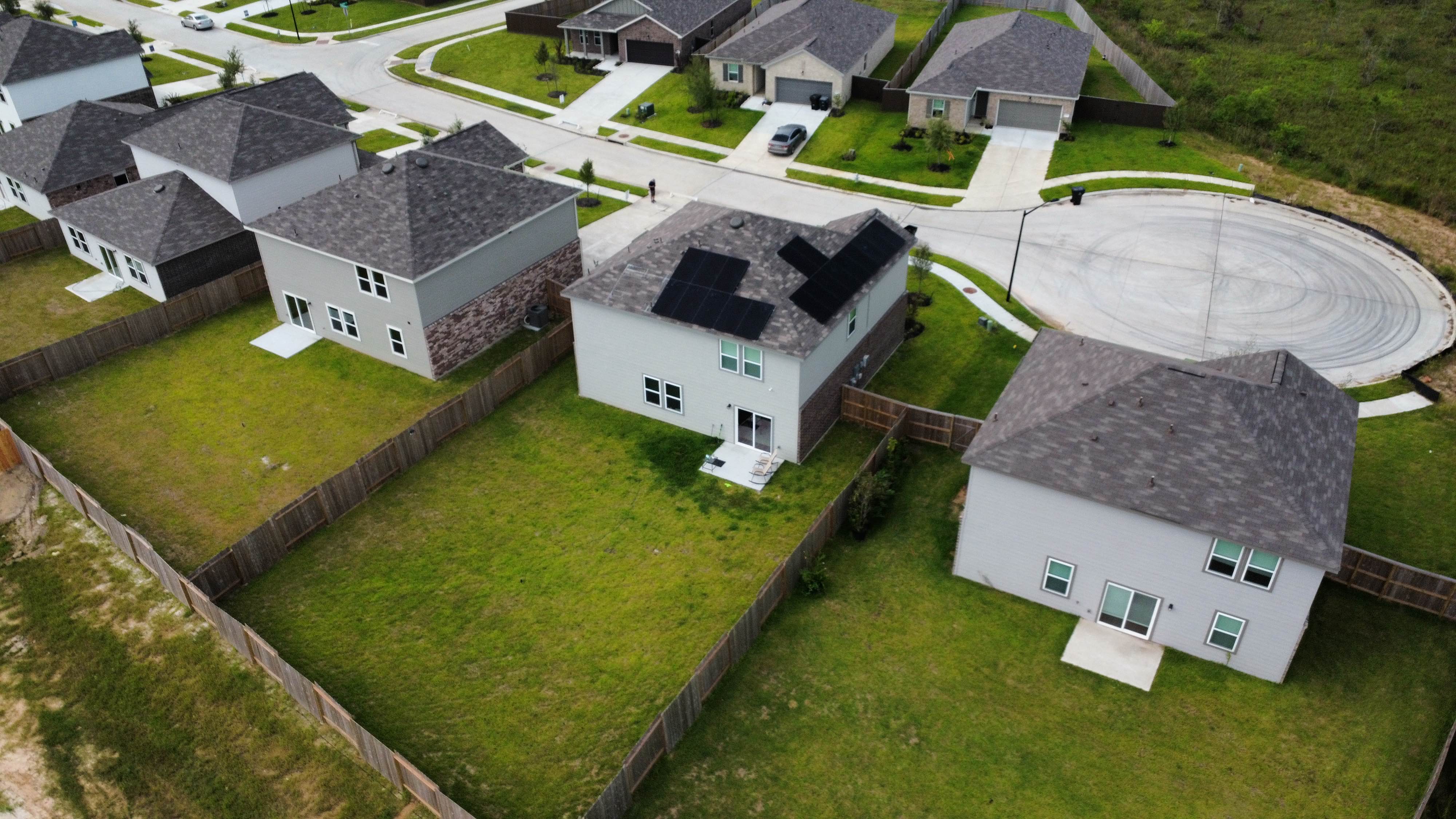 Drone view of completed roof with solar panels
