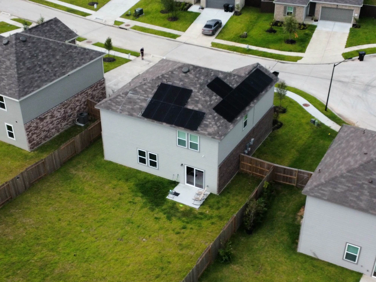 Drone view of completed roof with solar panels