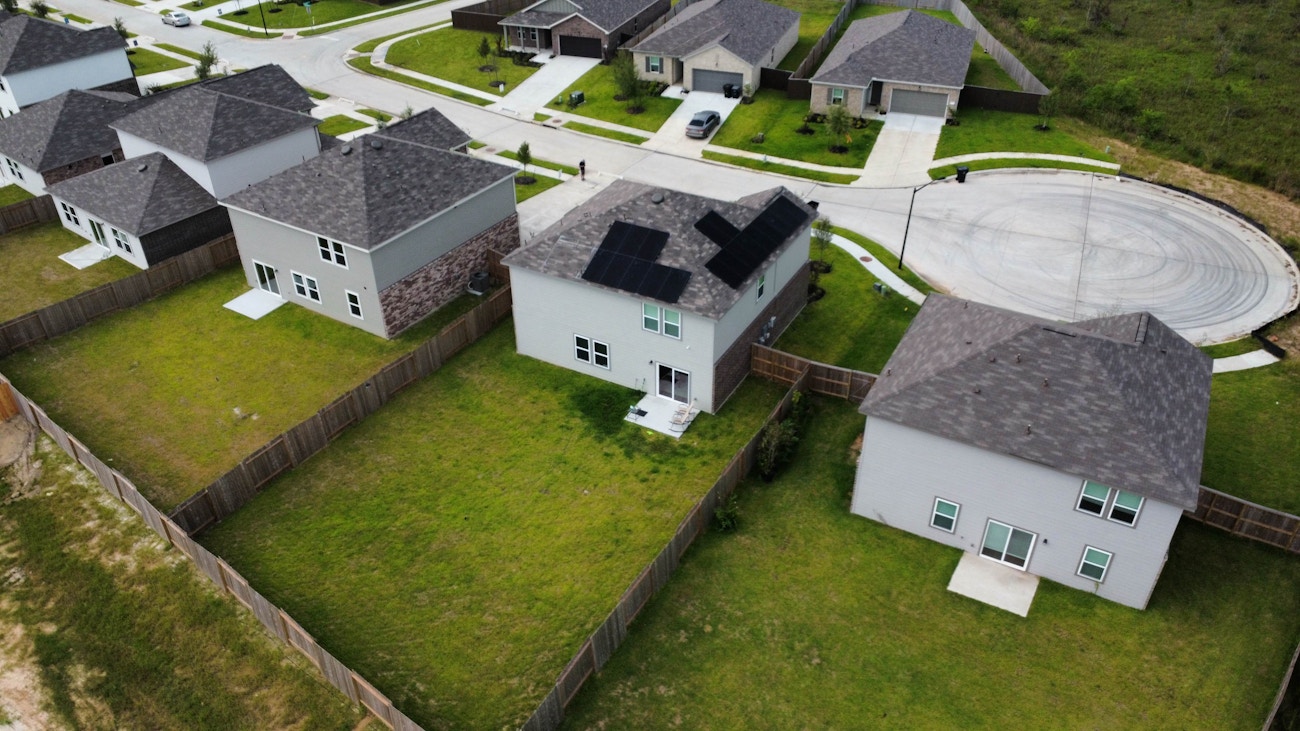 Drone view of completed roof with solar panels