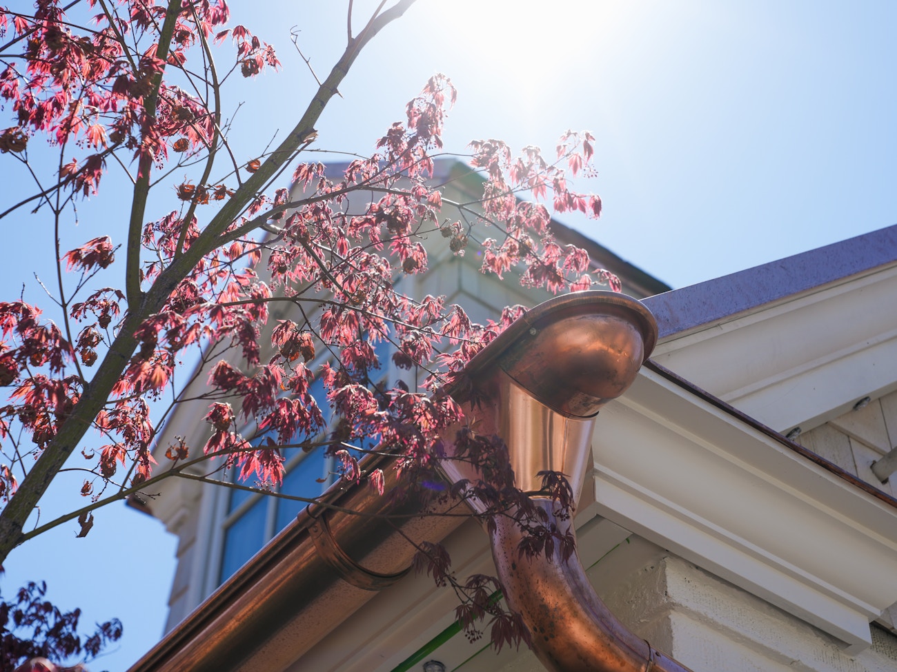 Gutter end with downspout