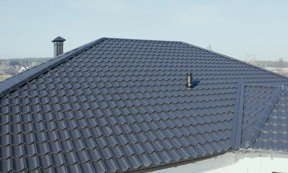 Metal roof repair on home