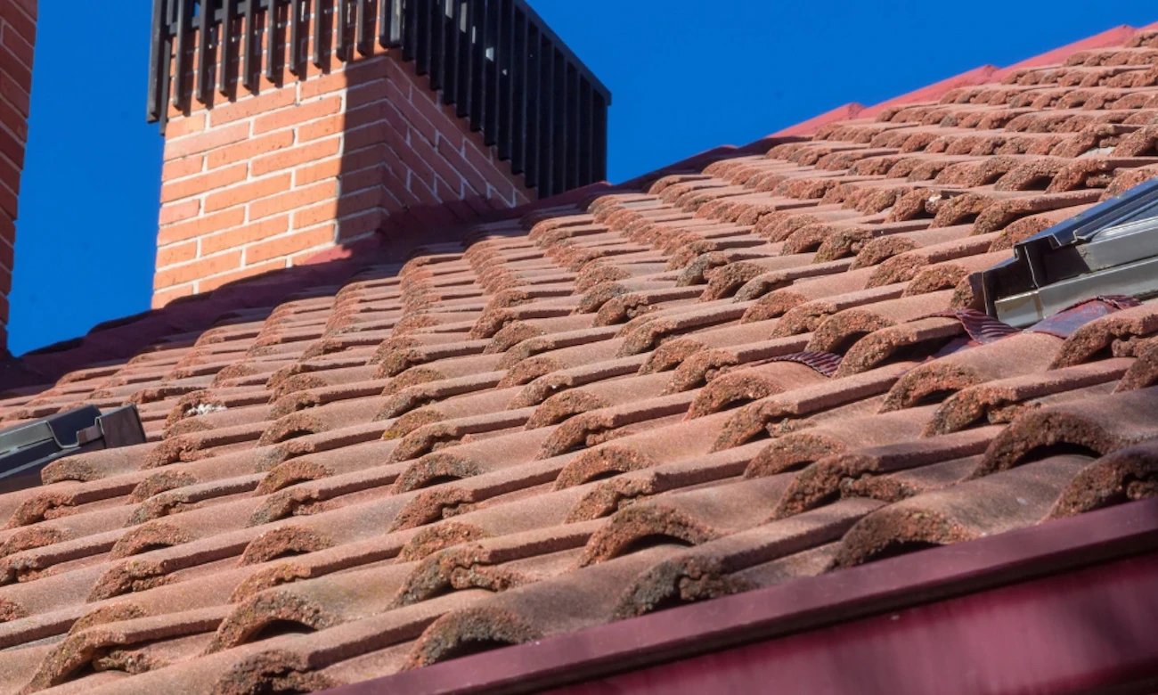 Tile roof repair on building