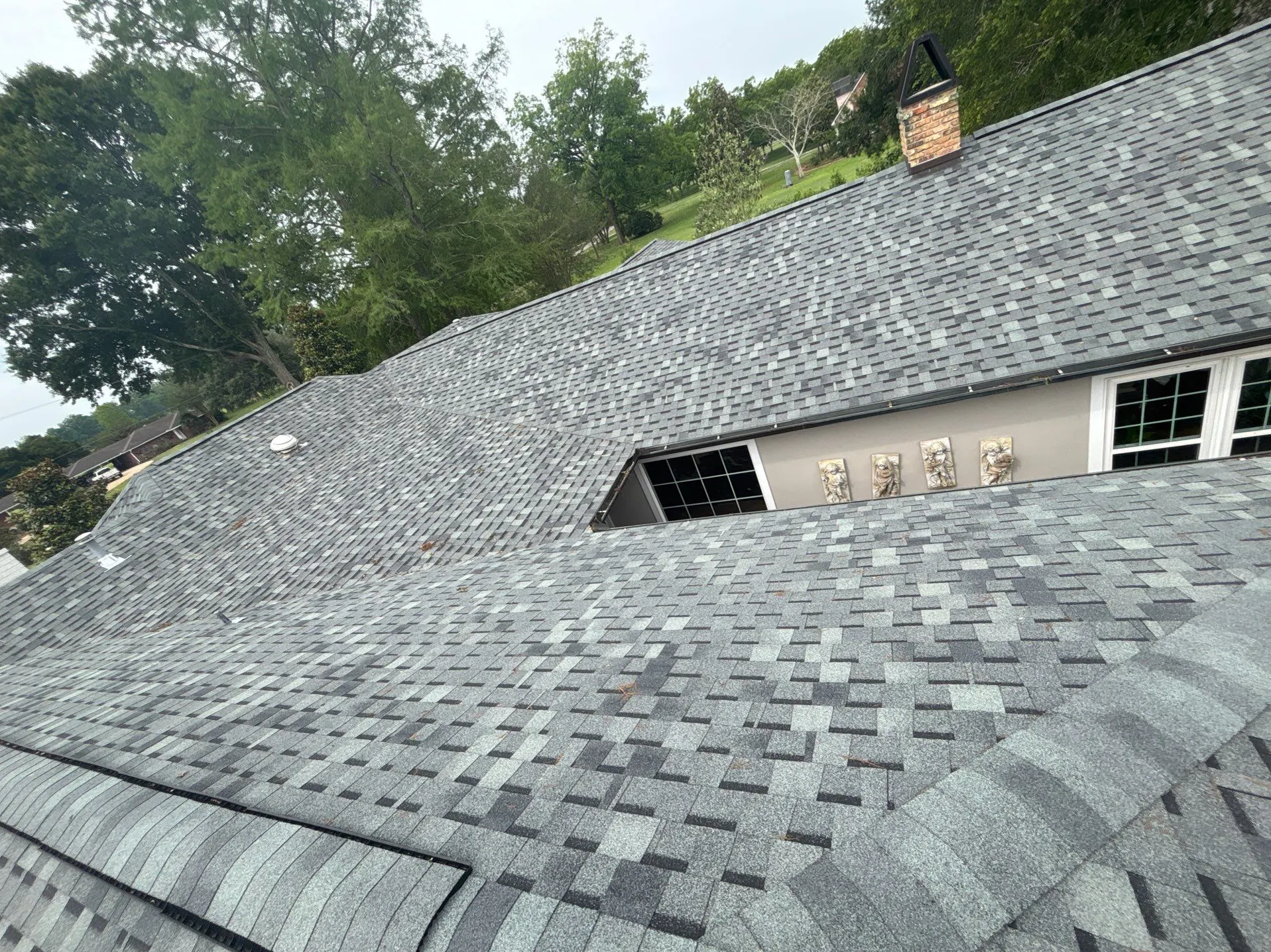 aerial view of residential roof replacement with grey architectural shingles and chimney - Boise, ID - Flux Boise Roofing & Siding