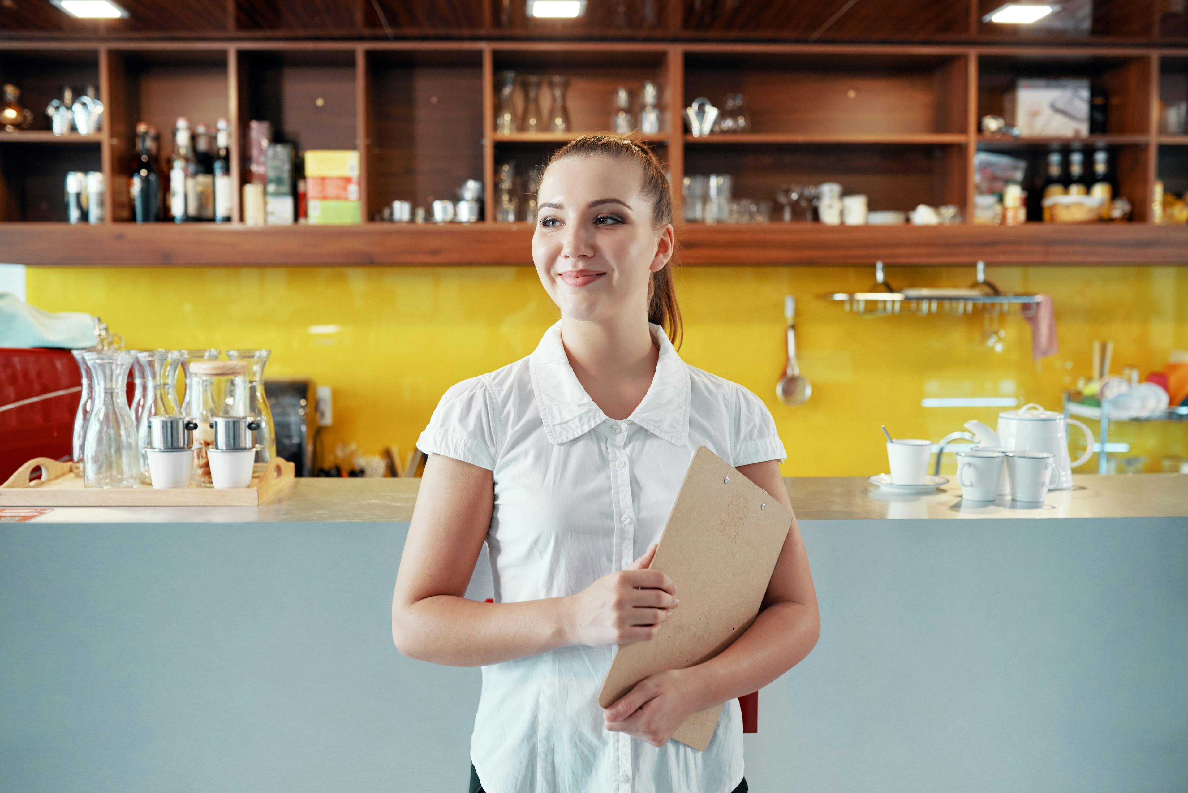 Restaurant manager smiling in the kitchen