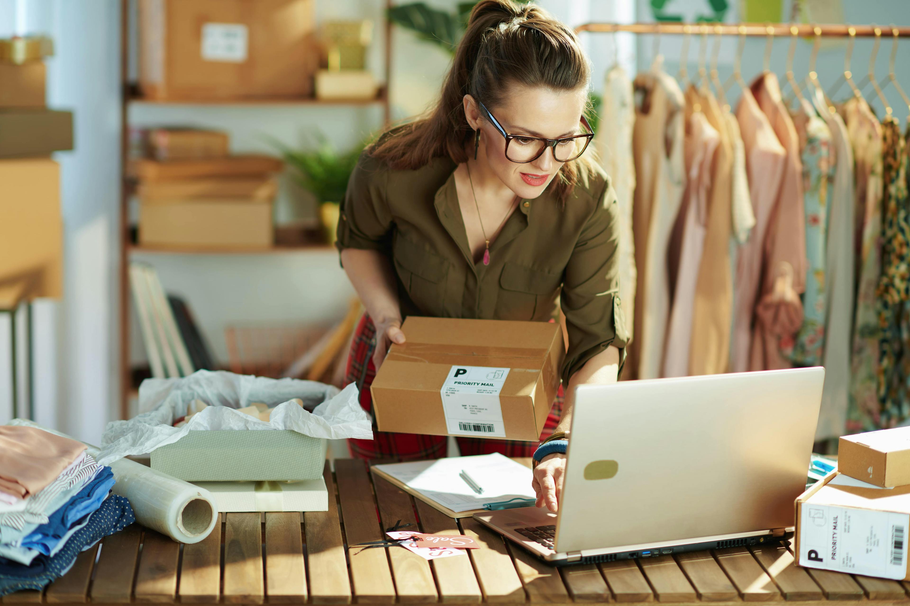 Woman packing an order for her online business
