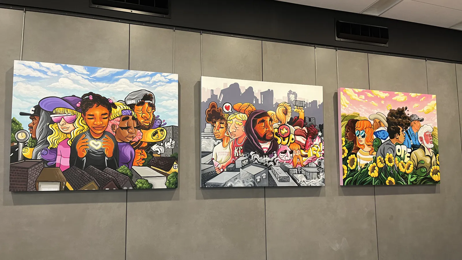 Triptych of colorful, cartoon-style paintings depicting diverse groups of people in urban and natural Kansas City scenes, with elements like rooftops, sunflowers, and city skylines in the background.