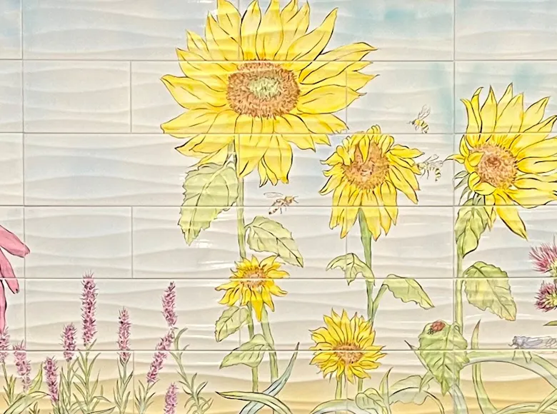 Panoramic artwork of sunflowers, coneflowers, birds, and grasses in a soft, pastel palette, evoking a serene prairie landscape