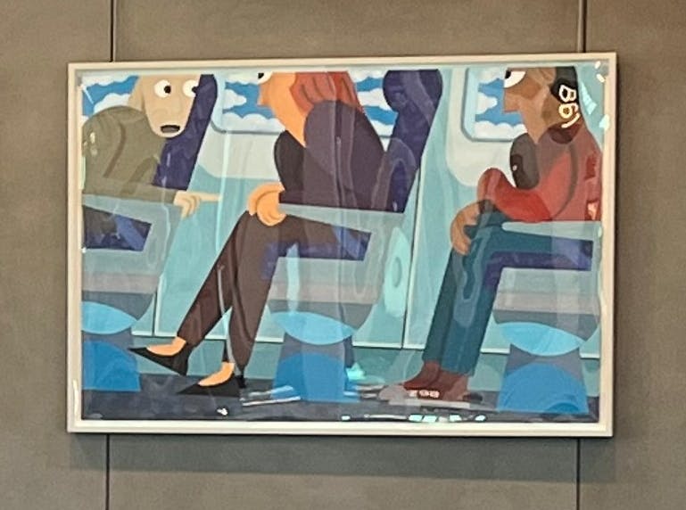 Three colorful paintings depicting stylized passengers on airplanes, each framed and mounted on a gray wall. The left shows a woman looking out a window with birds outside. The center shows multiple seated passengers. The right shows a woman pointing out a window with butterflies flying by.