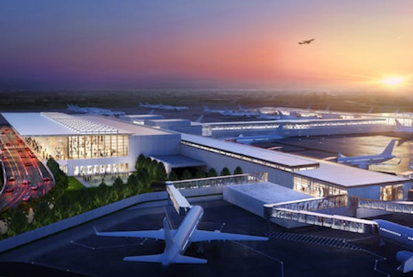 Artist's rendering of an aerial view of Kansas City International Airport at sunset with multiple airplanes parked at gates, one plane taxiing on the tarmac, and another in flight above the horizon.