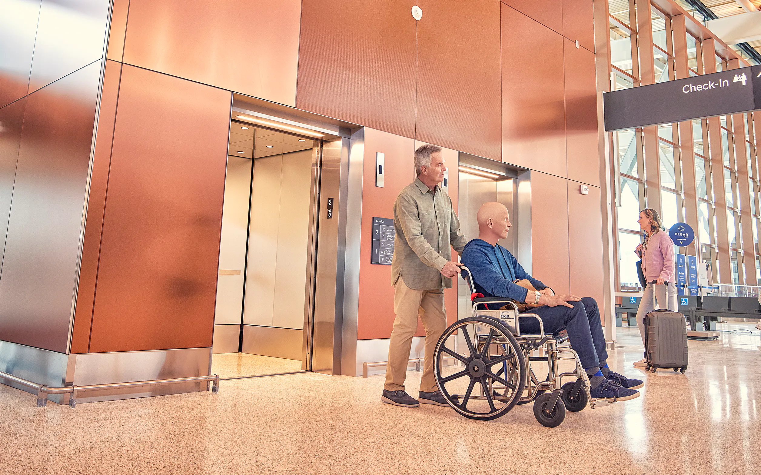 Wheelchair travelers using the check-In hall elevators