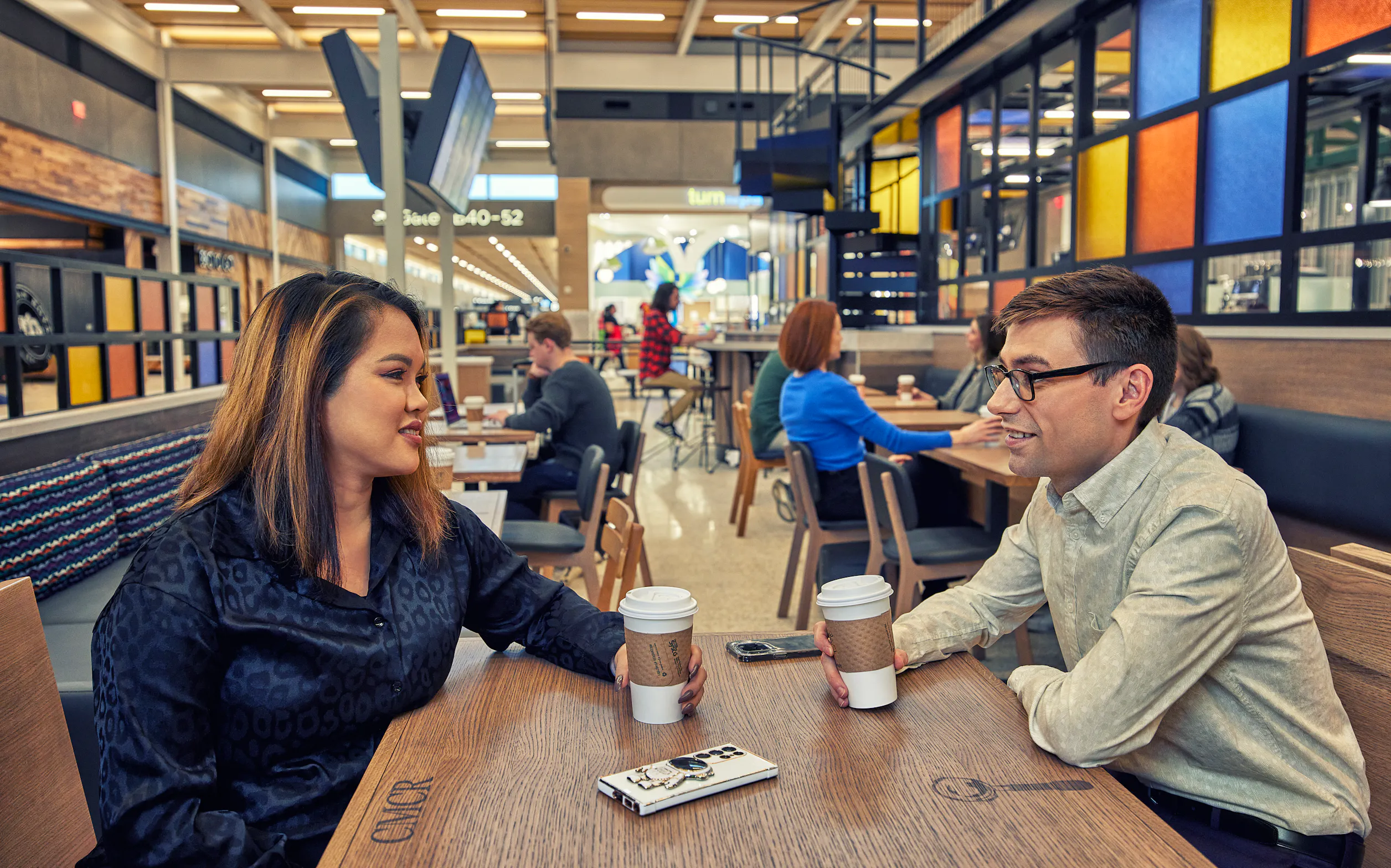 Travelers enjoying coffee at the airport
