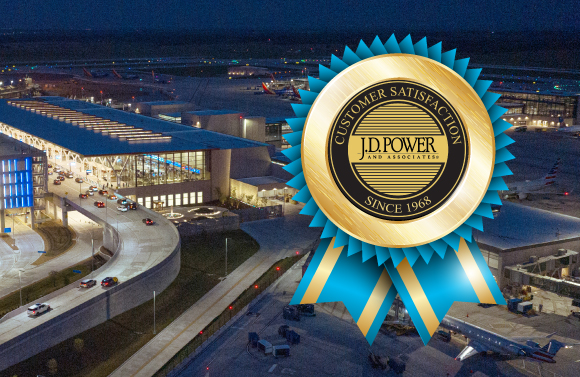 Aerial view of Kansas City International Airport at night, with a JD Power award icon superimposed on top