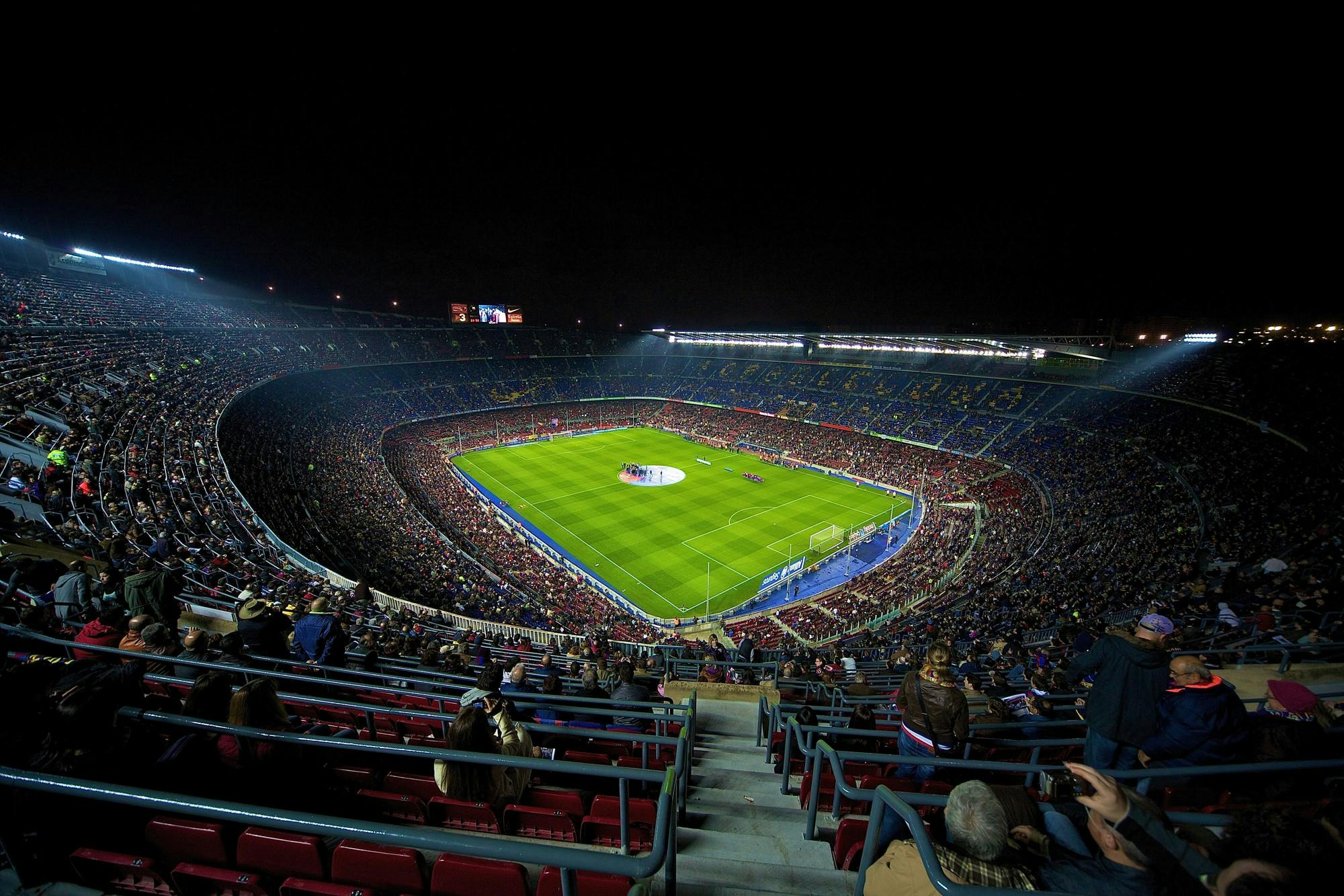 a stadium filled with lots of people watching a soccer game