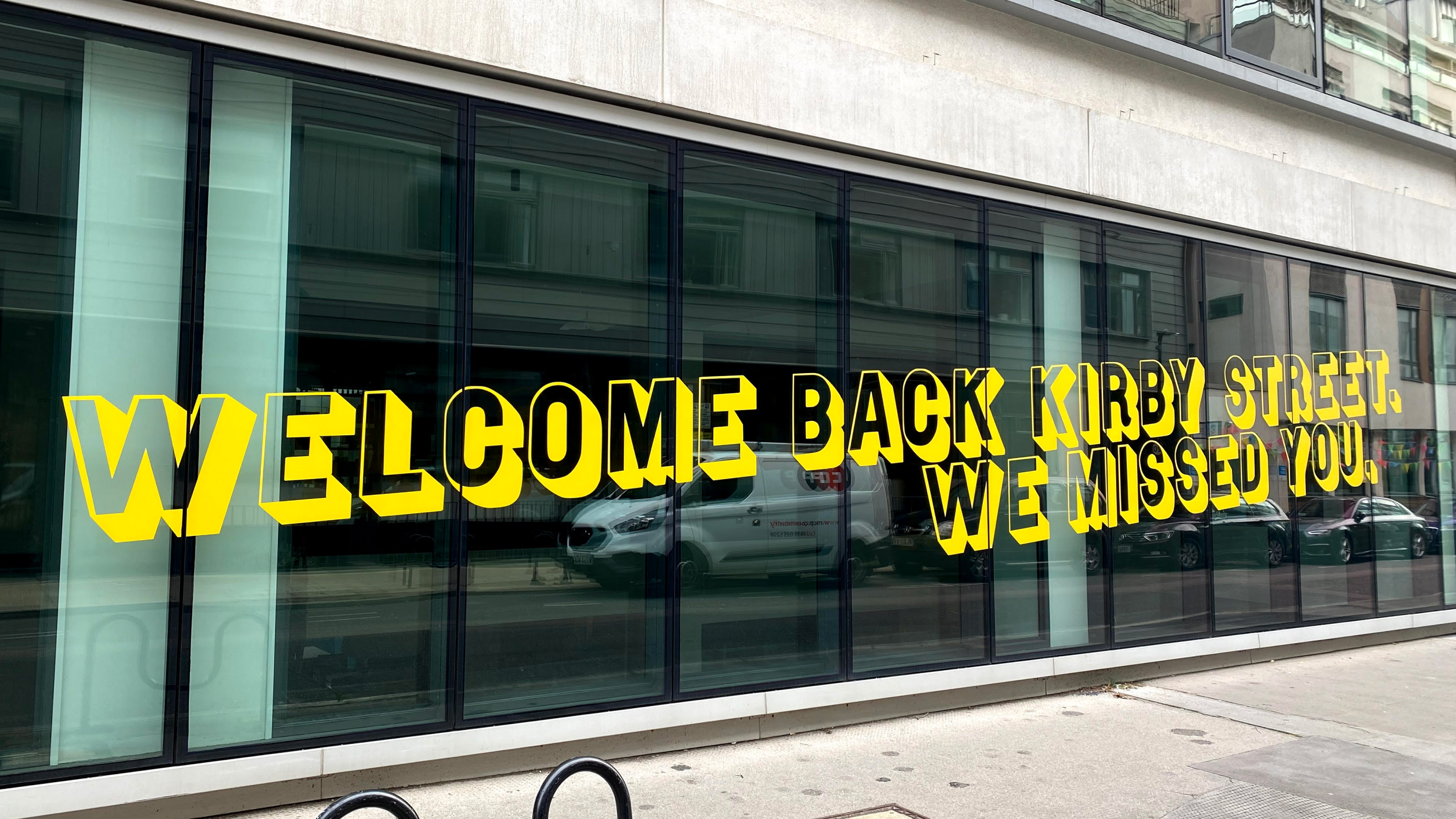 Welcome back Fold7 office window signage