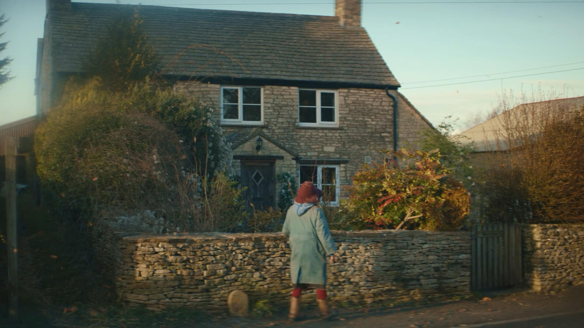 Woman outside house - One Day Could Be Today Rightmove campaign