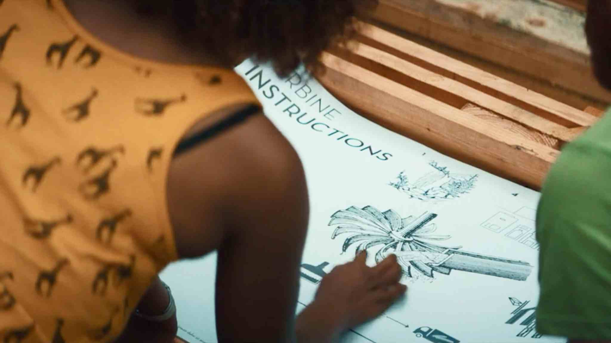 Woman readuing a turbine instructions