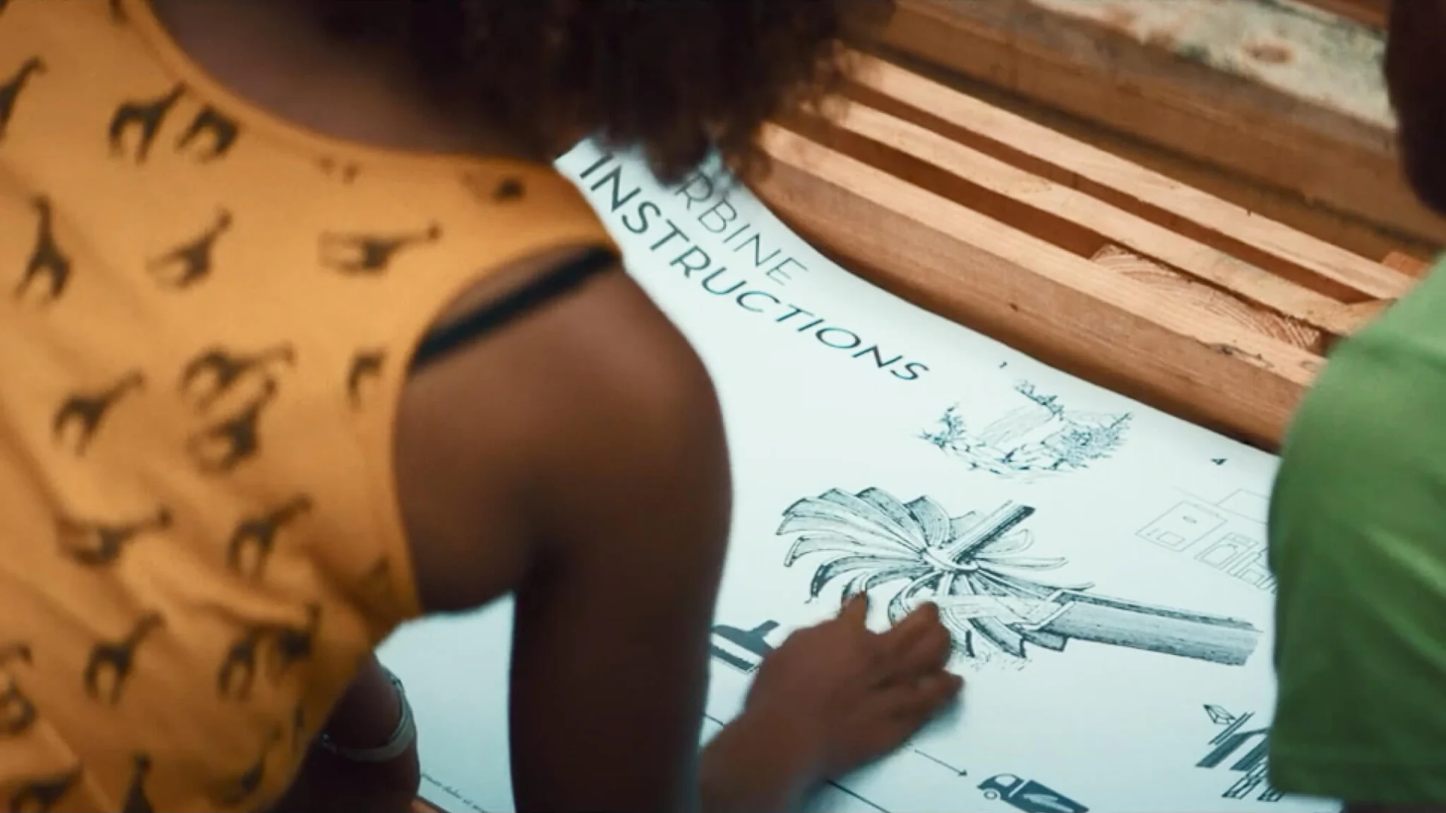 Woman readuing a turbine instructions