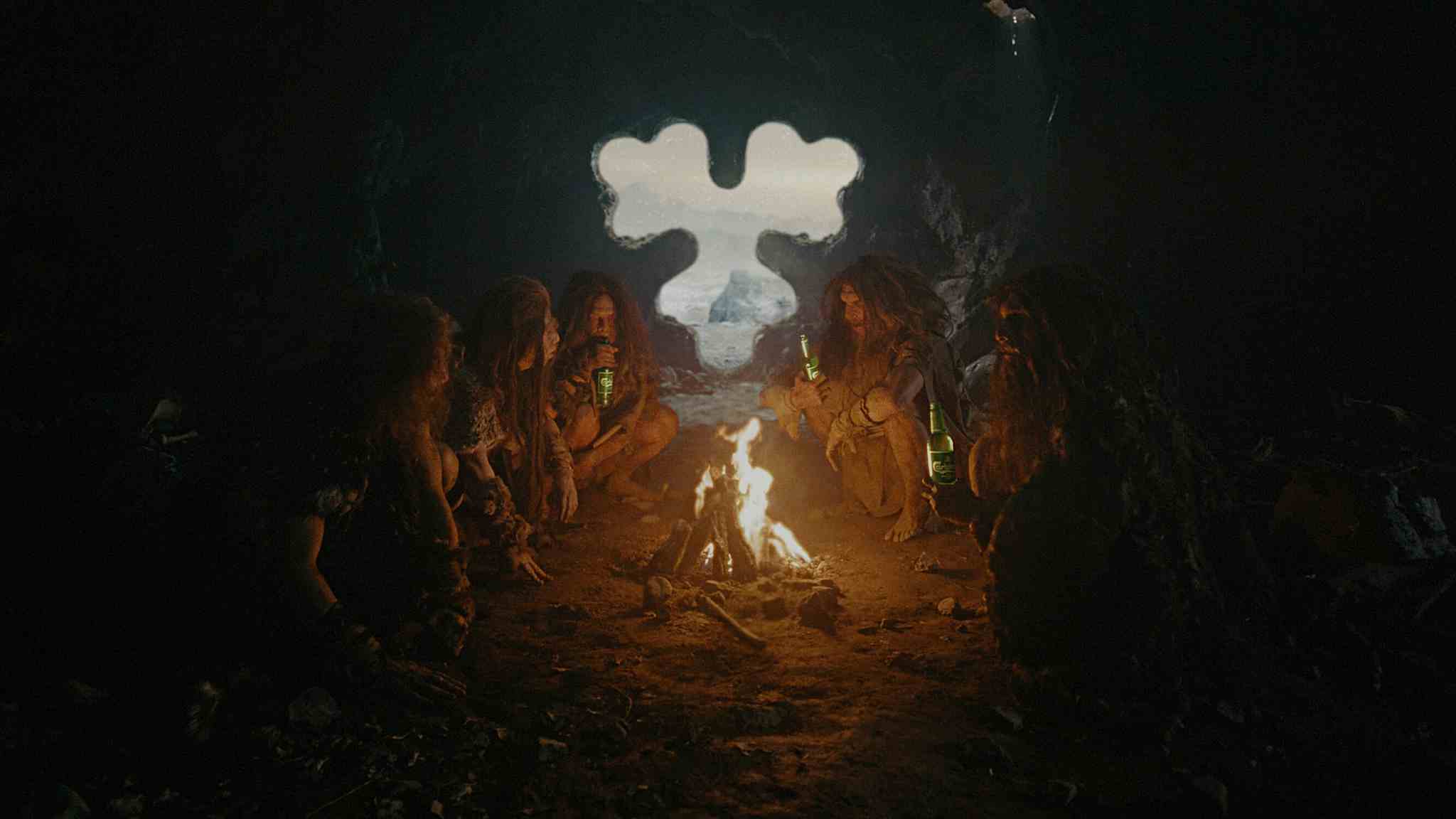 Cavemen sitting around a fire