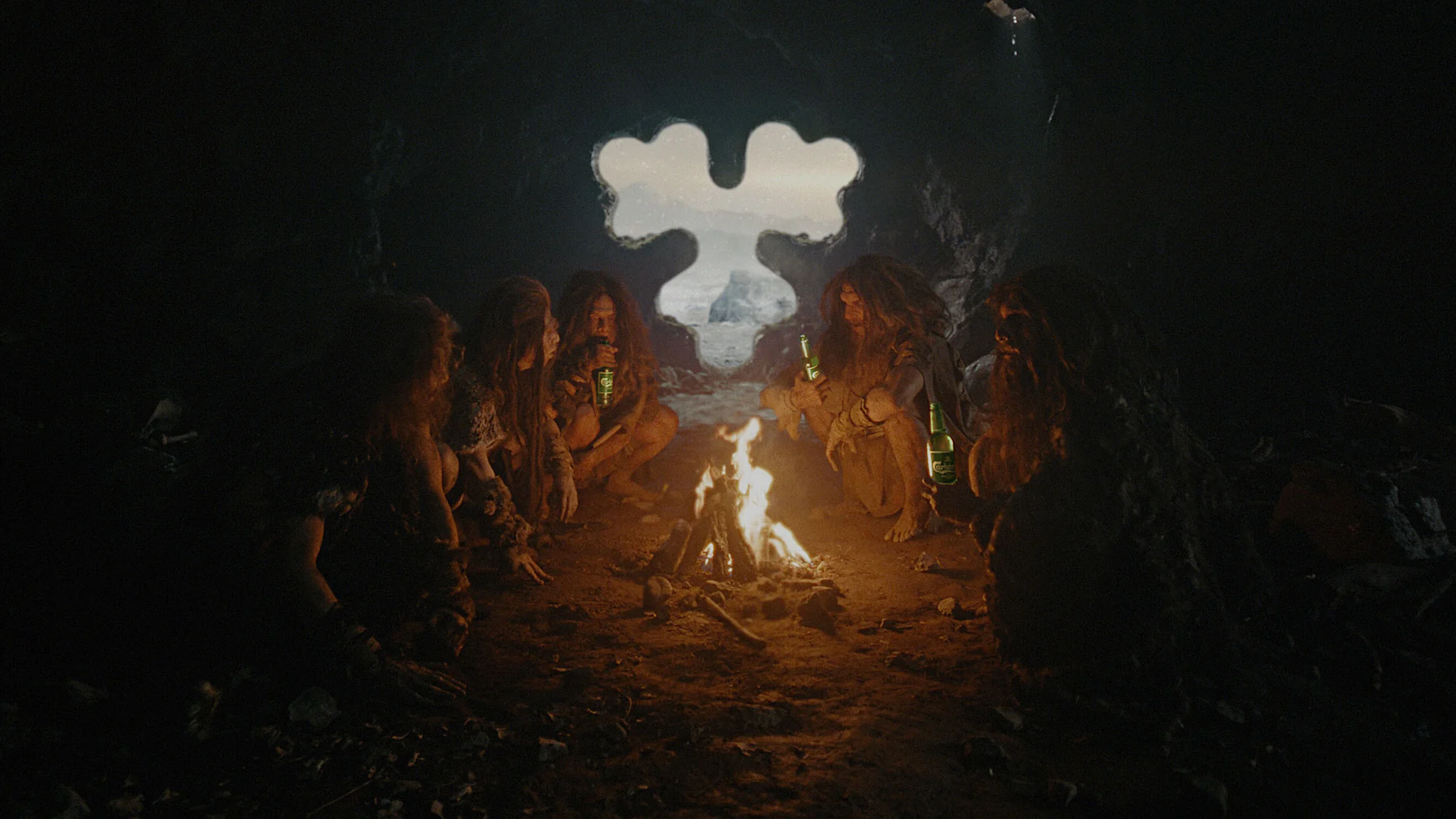 Cavemen sitting around a fire