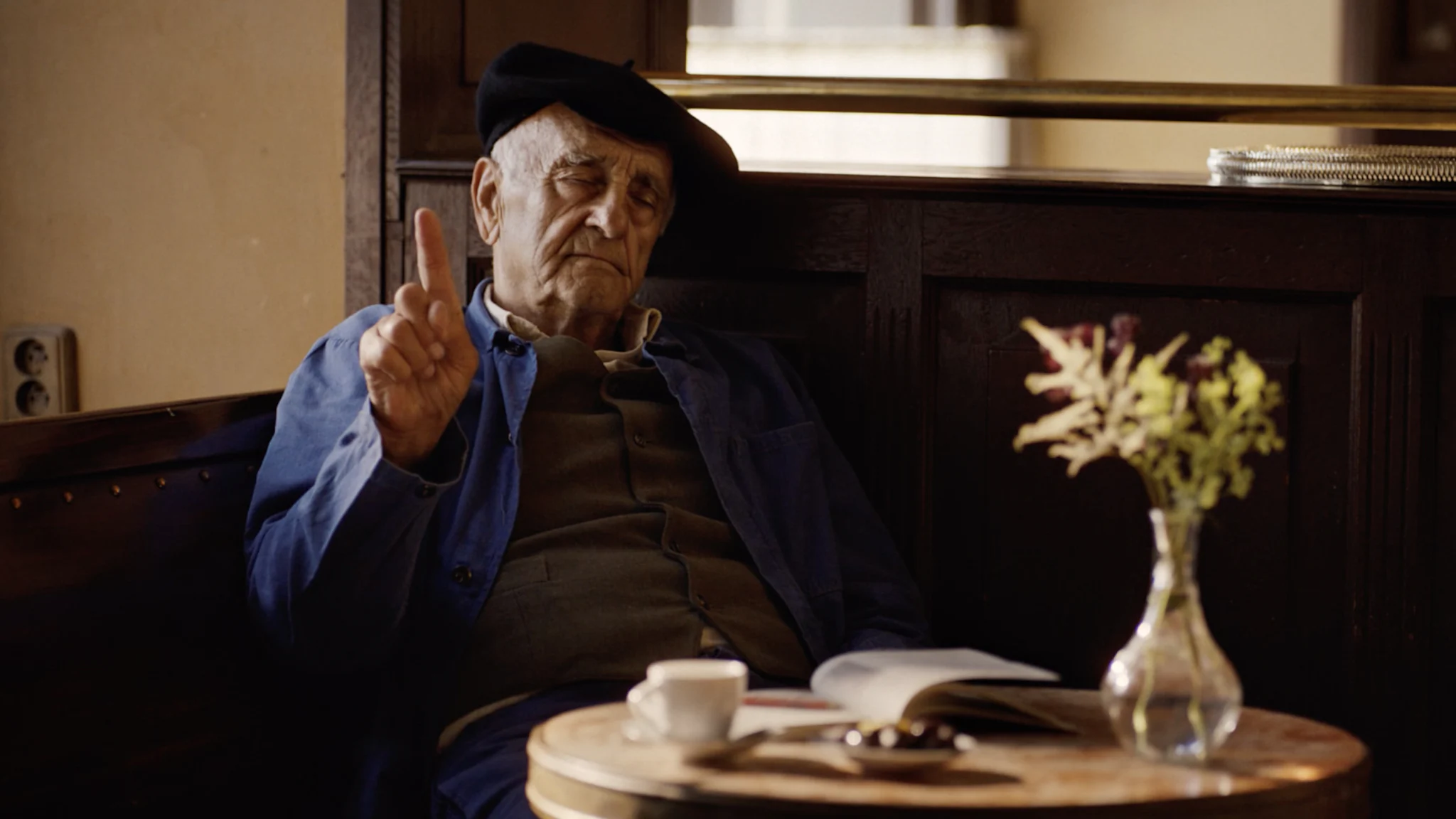 An Old Man Holding Up One Finger from St Pierre Eat Avec Respect Campaign