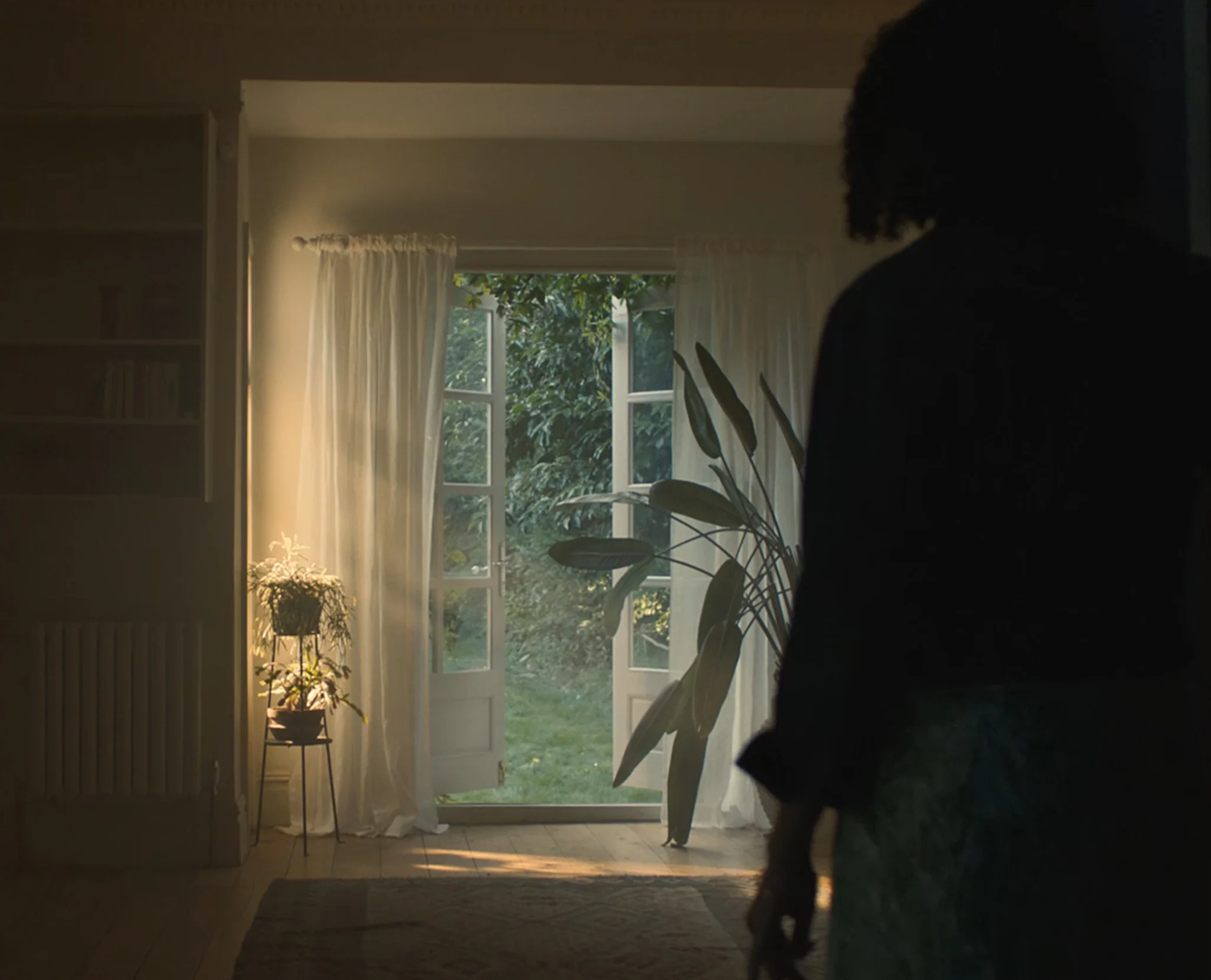 Female silhoutte looking at an open door from Rightmove This is it