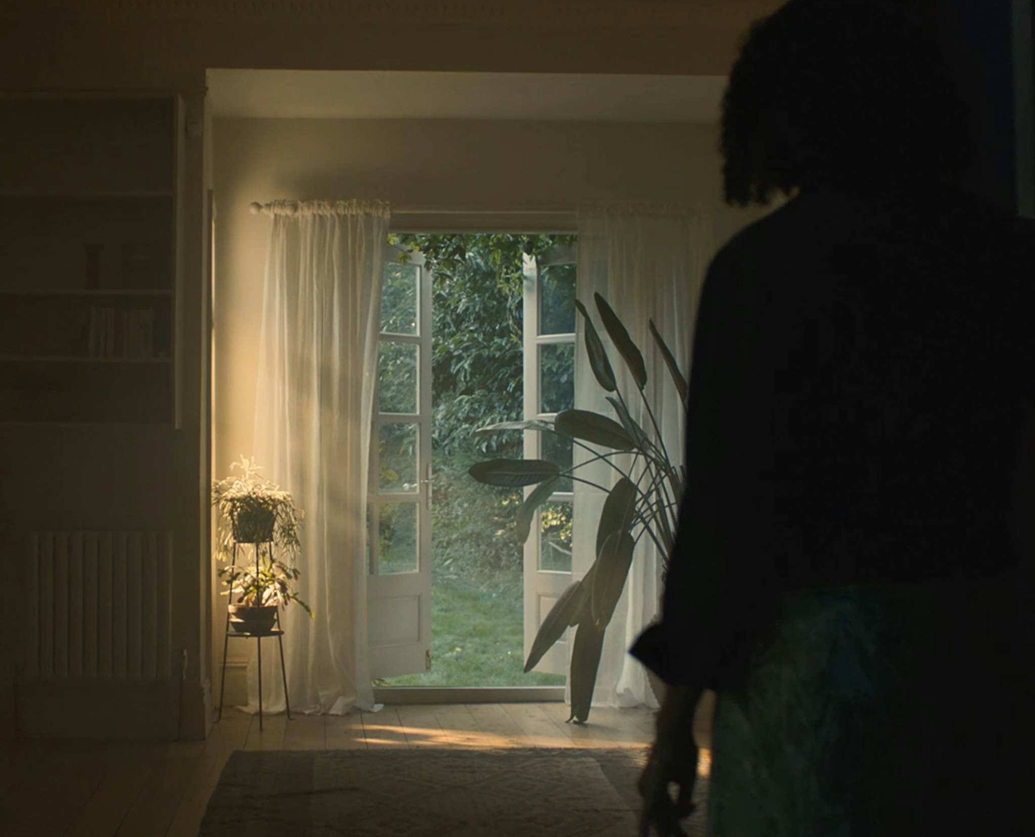 Female silhoutte looking at an open door from Rightmove This is it