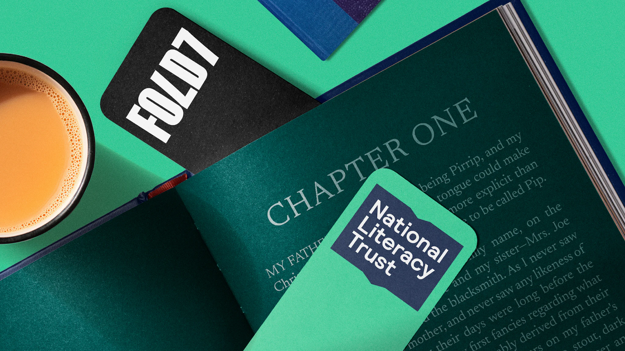 Green Book with a book mark of National Literacy Trust and Fold7