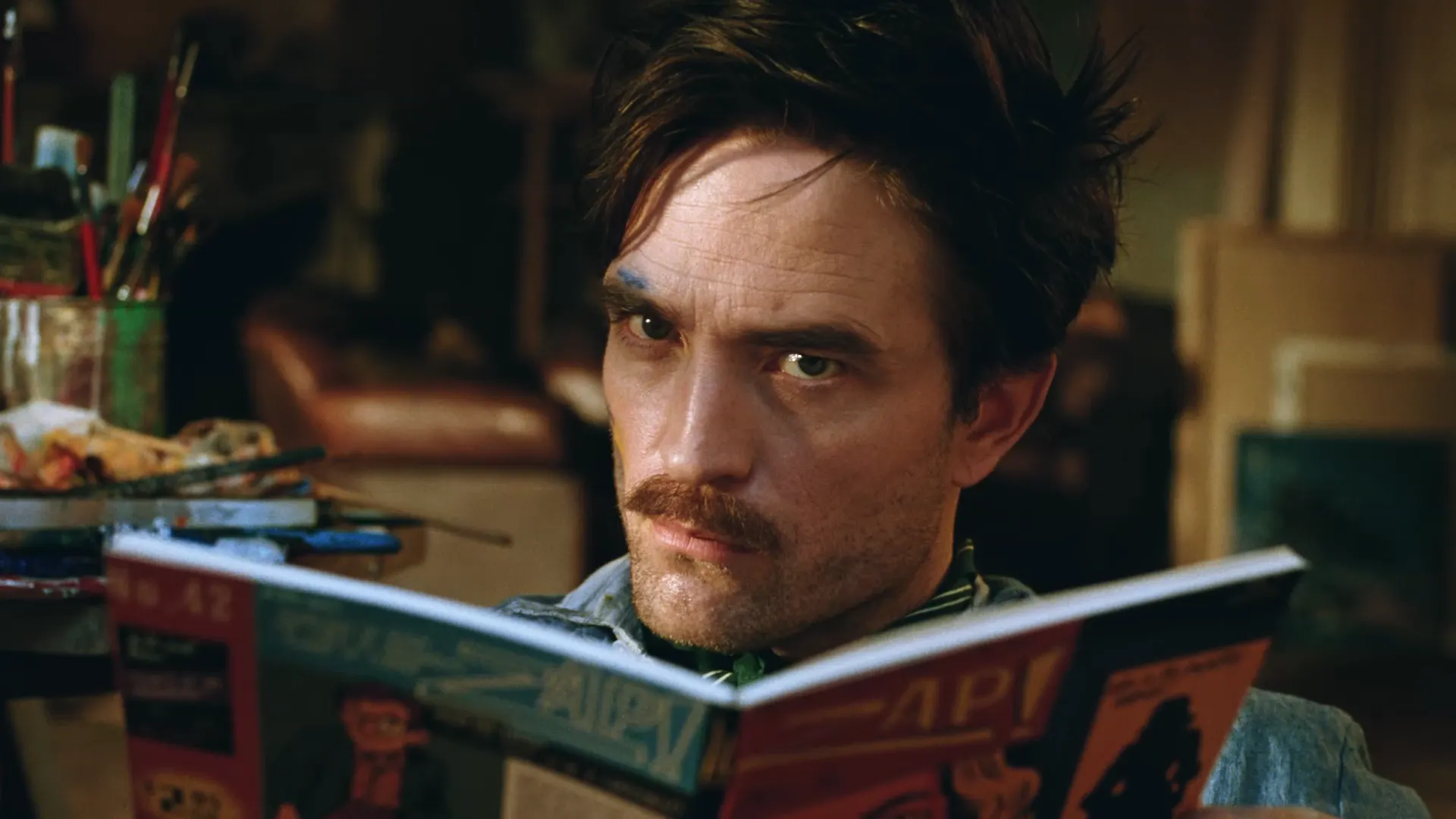 A man reading a book for unquestionably good taste ad campaign