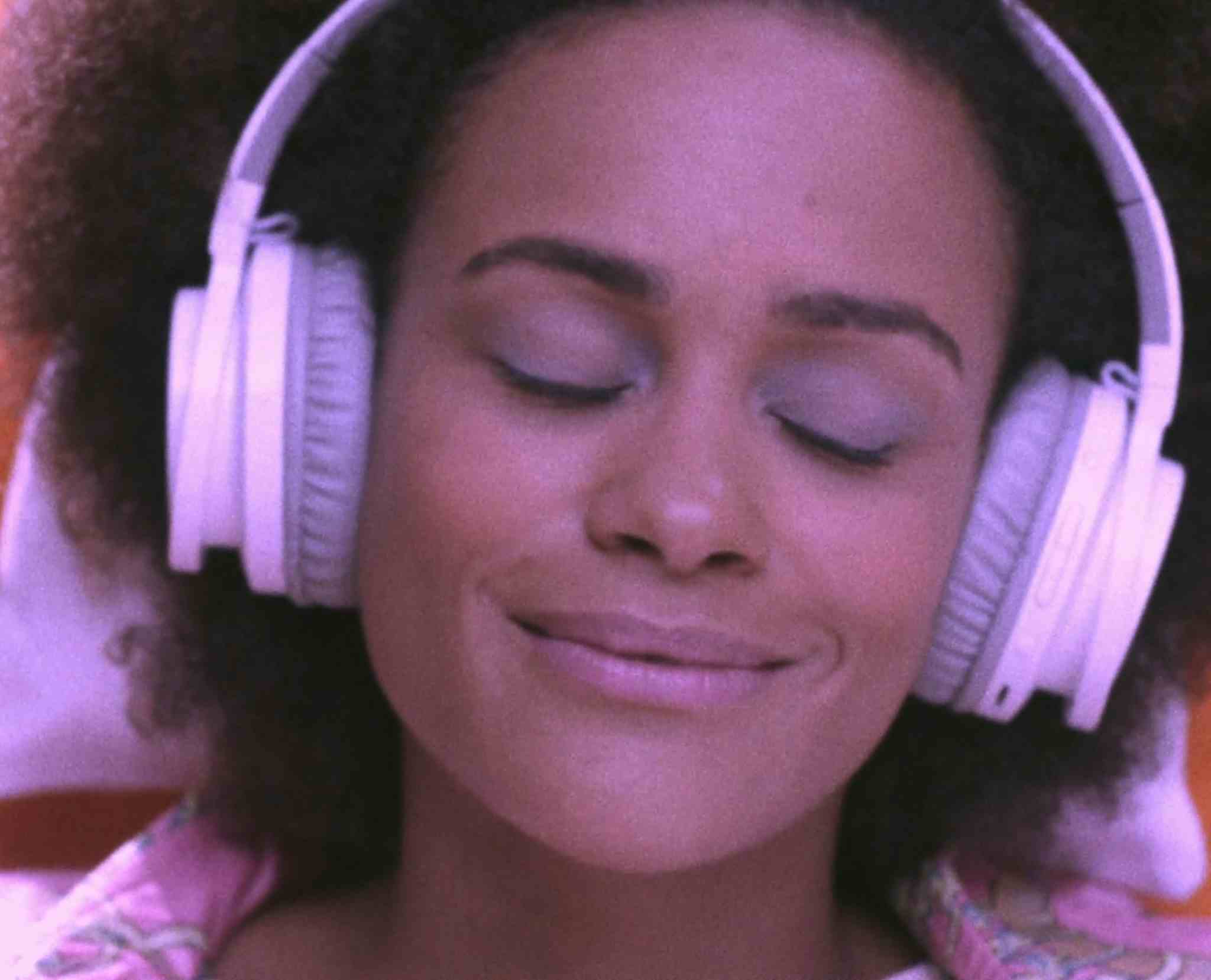 Woman with headphones listening to Audible