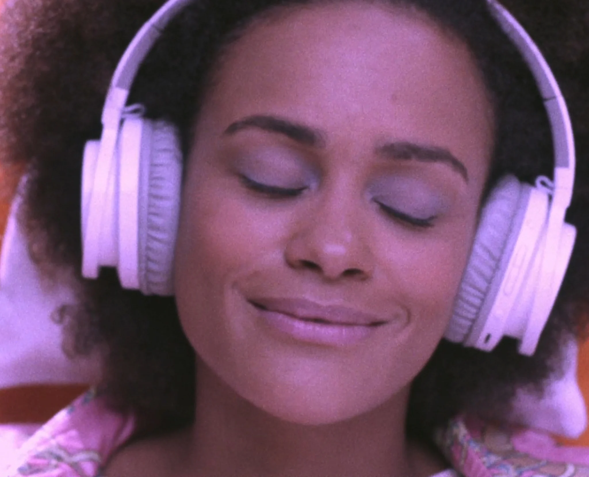 Woman with headphones listening to Audible