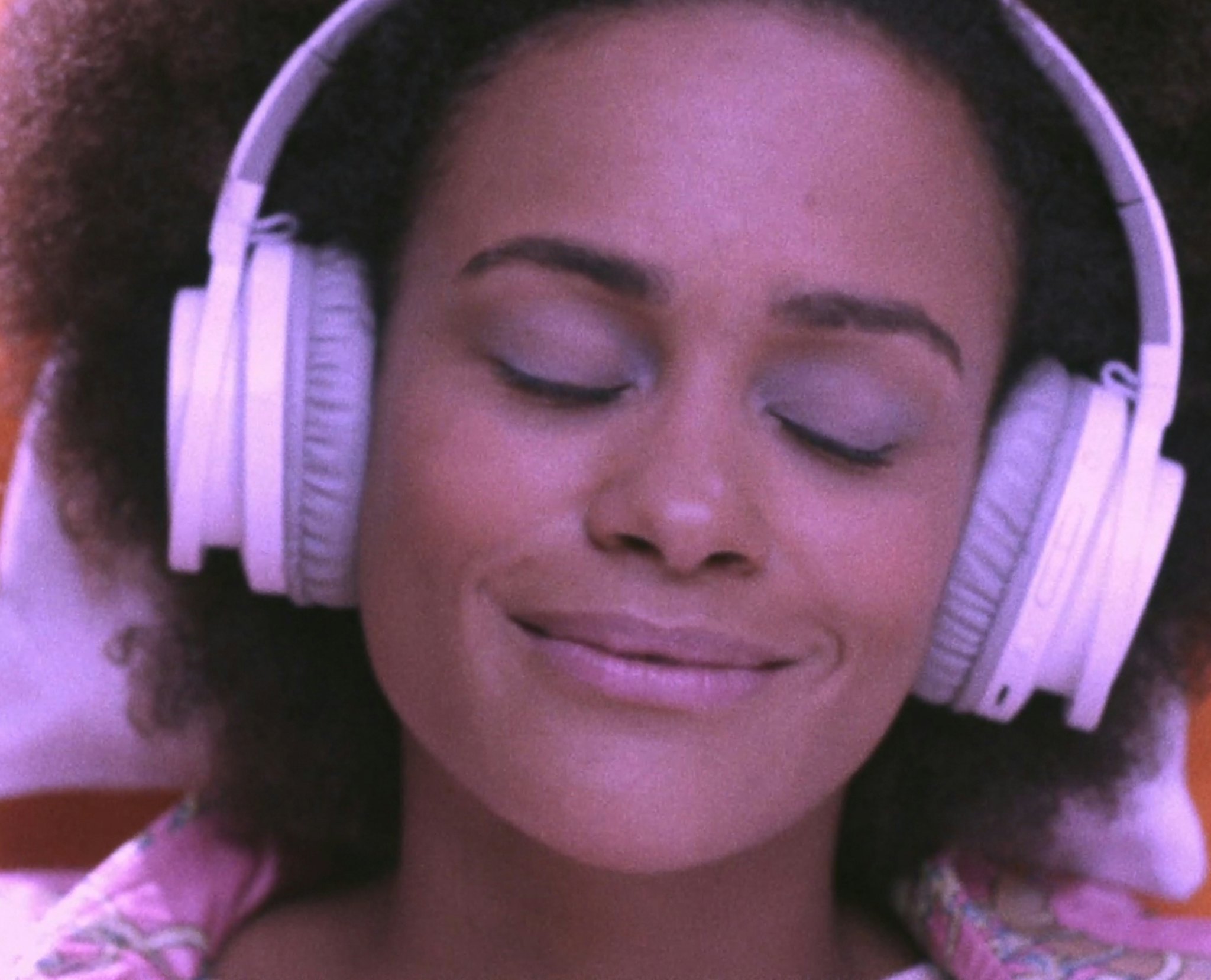 Woman with headphones listening to Audible