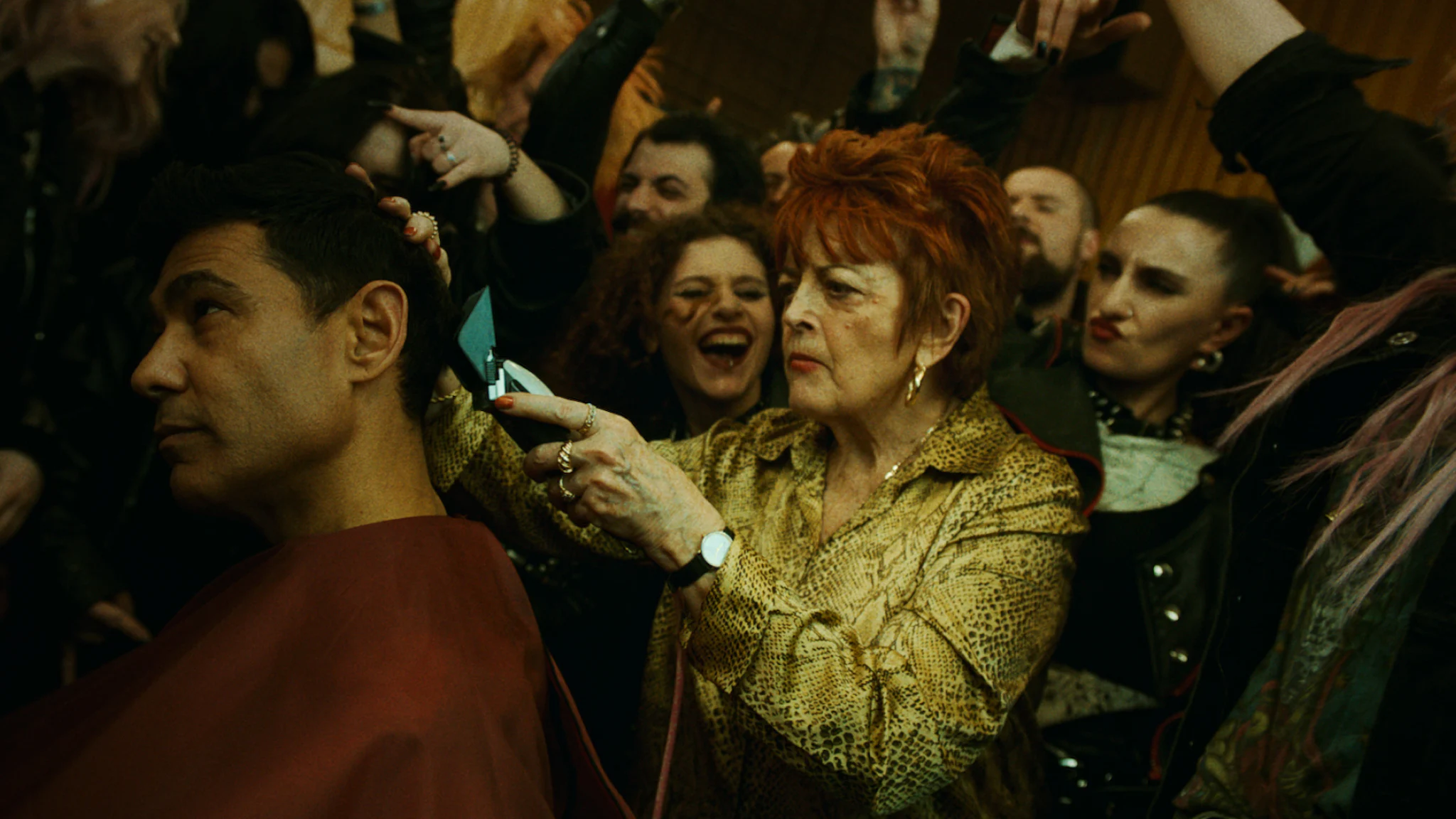 Woman in a crowd shaving a man's head from Power Up What You Do campaign