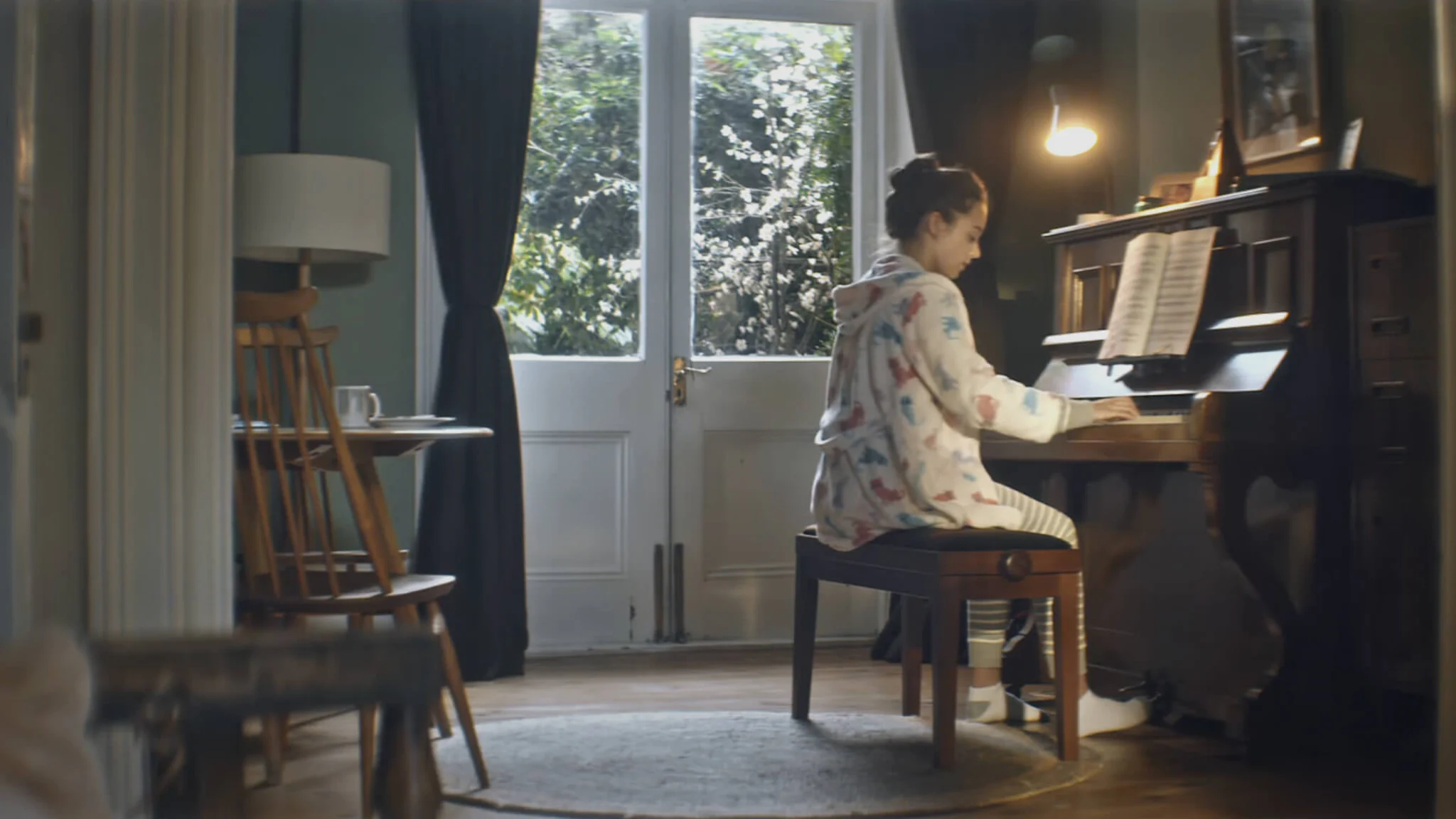 Woman playing a piano from Gumtree Opportunity Campaign