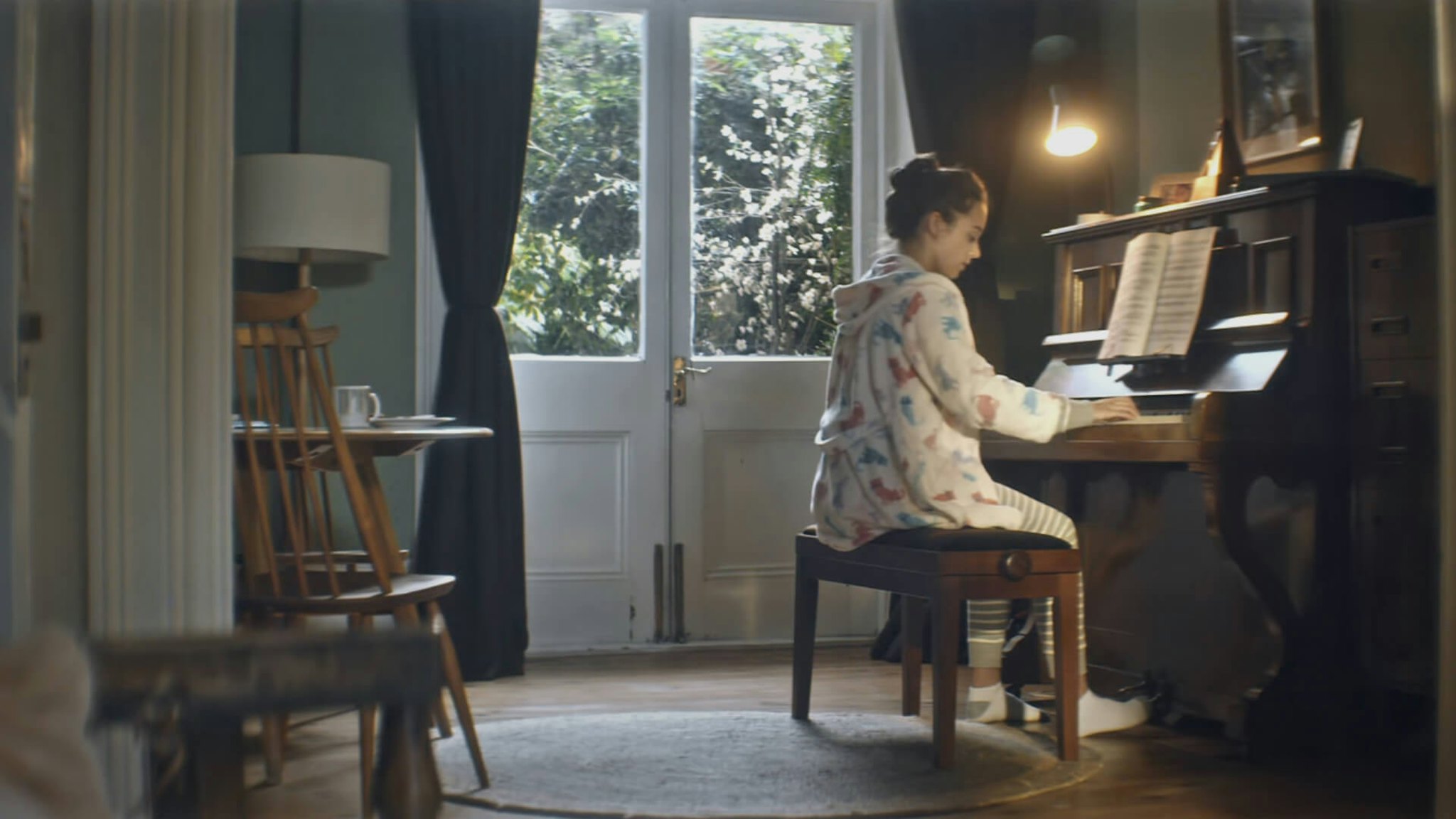 Woman playing a piano from Gumtree Opportunity Campaign