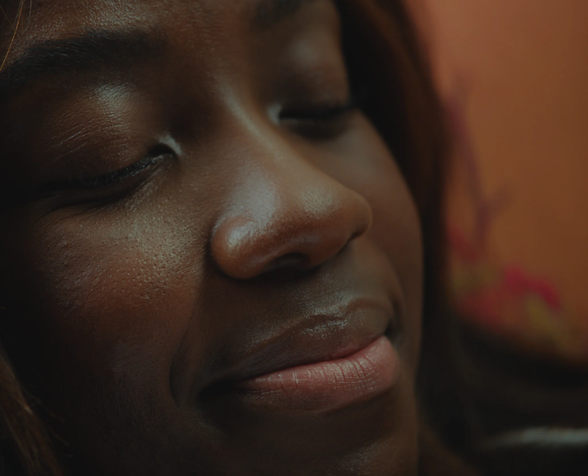 Photo of a woman smiling - CoppaFeel Know Yourself campaign