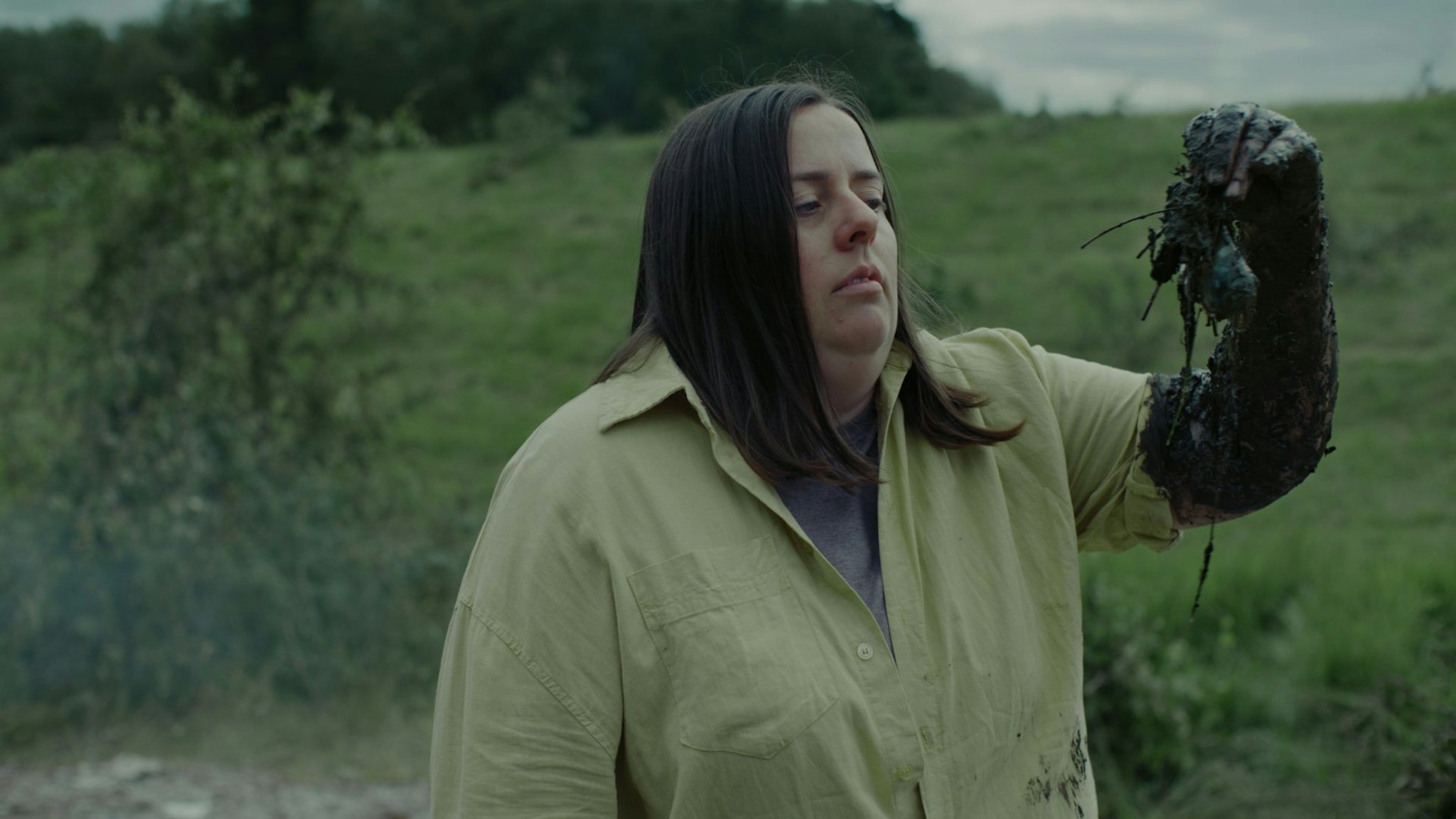 Audible Laugh Through It Campaign photo of a woman with muddy vegetables