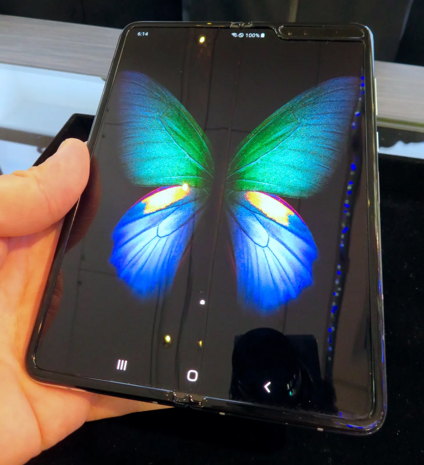 Samsung Galaxy Fold in 2019, held open in hand