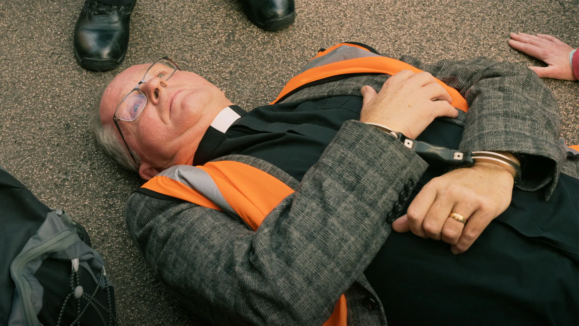A priest lies on the ground